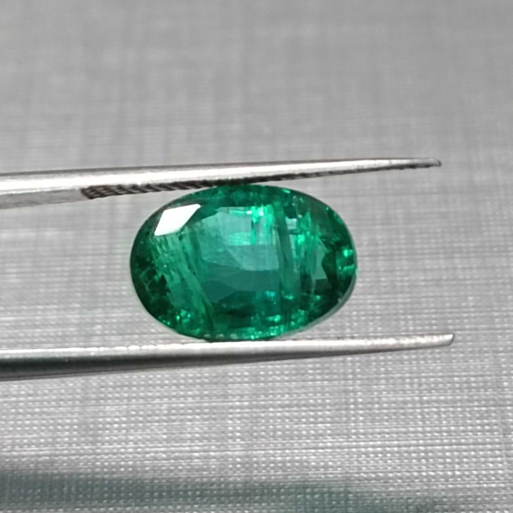 3.02ct GSI certified oval cut deep vivid green Pakistan emerald gem