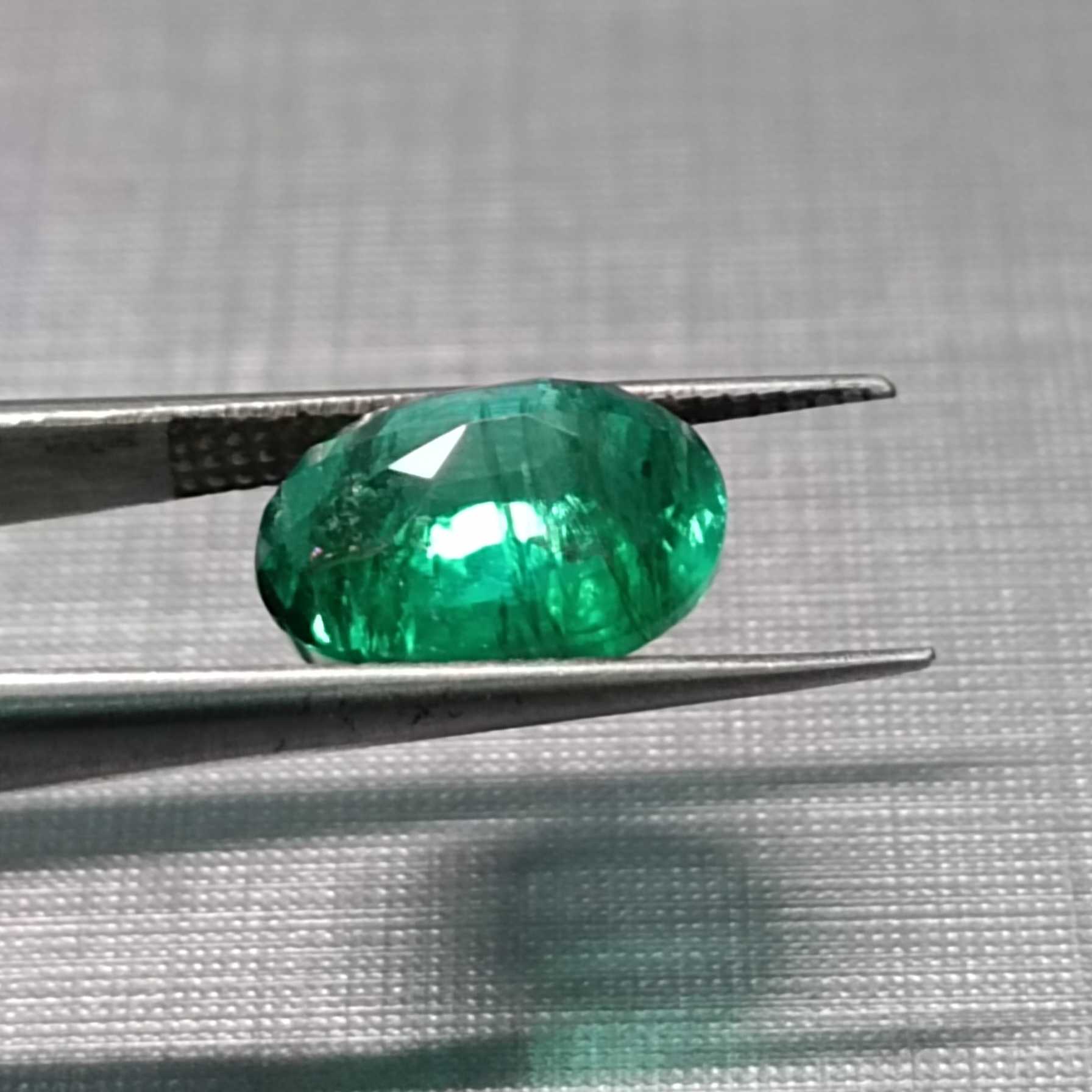 3.02ct GSI certified oval cut deep vivid green Pakistan emerald gem