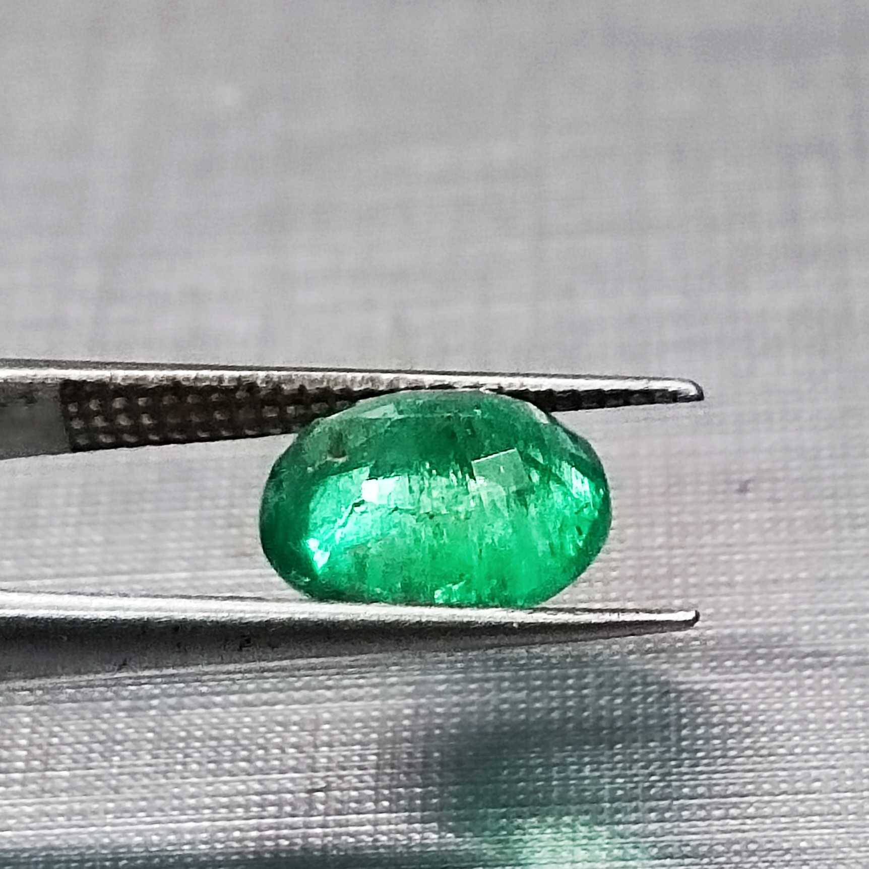 1.82ct deep vivid green oval cut emerald stone
