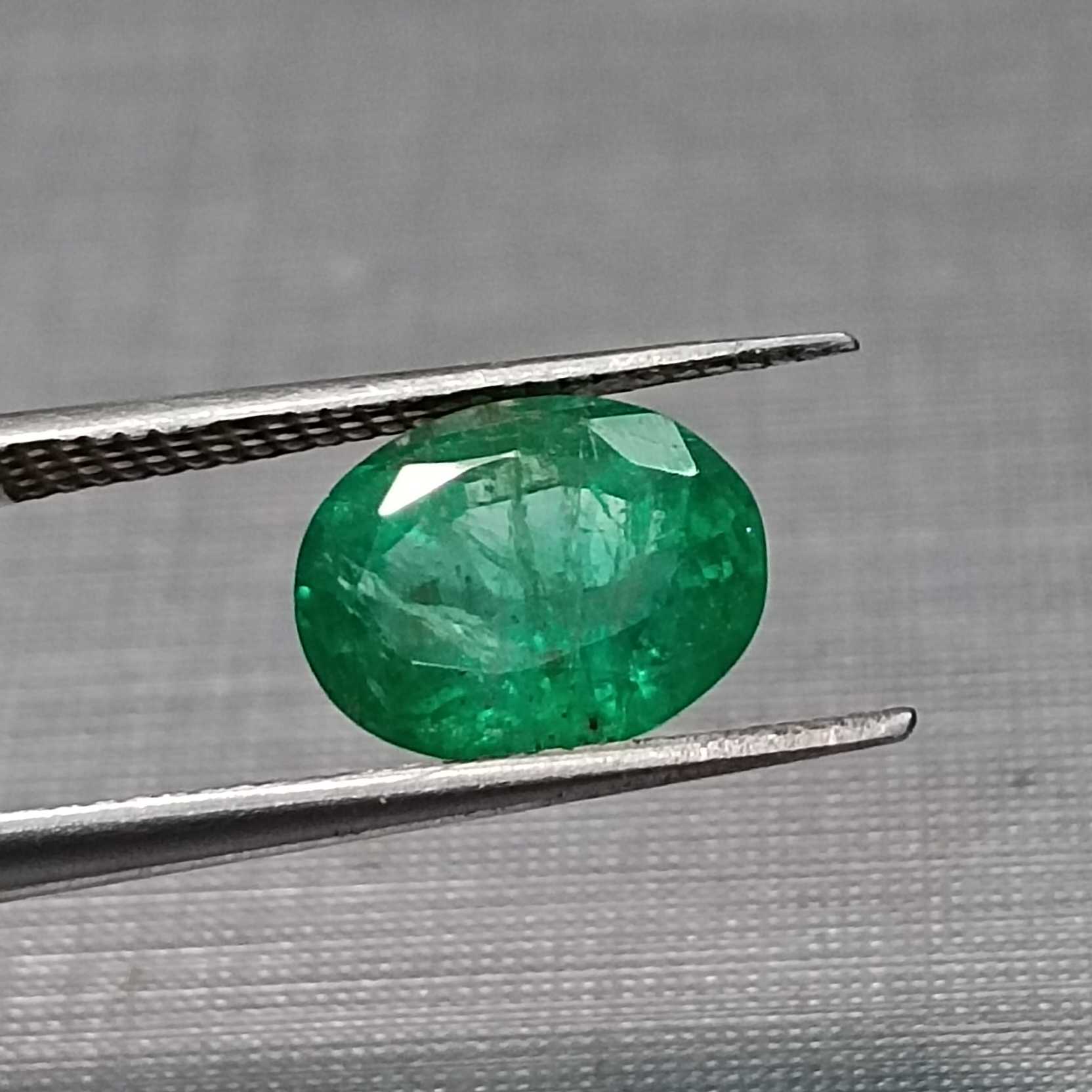 1.82ct deep vivid green oval cut emerald stone