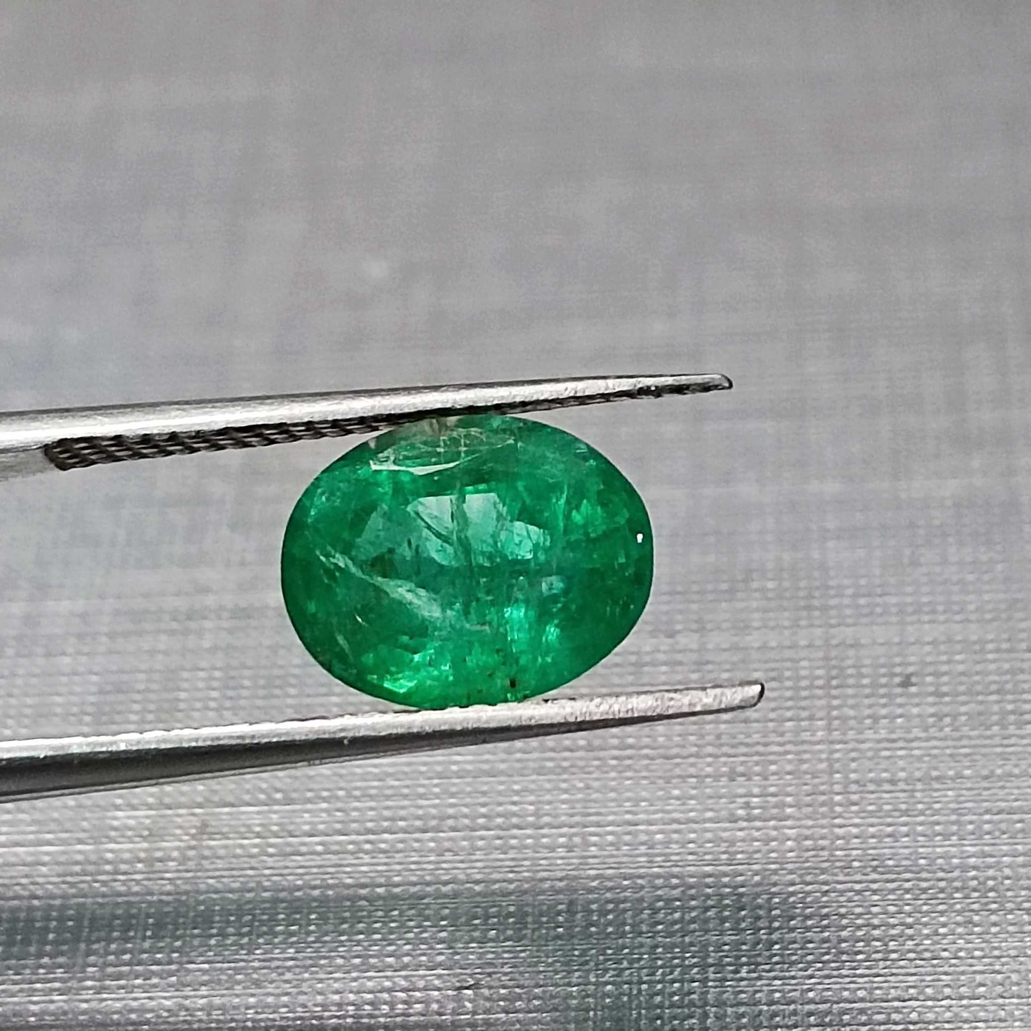 1.82ct deep vivid green oval cut emerald stone