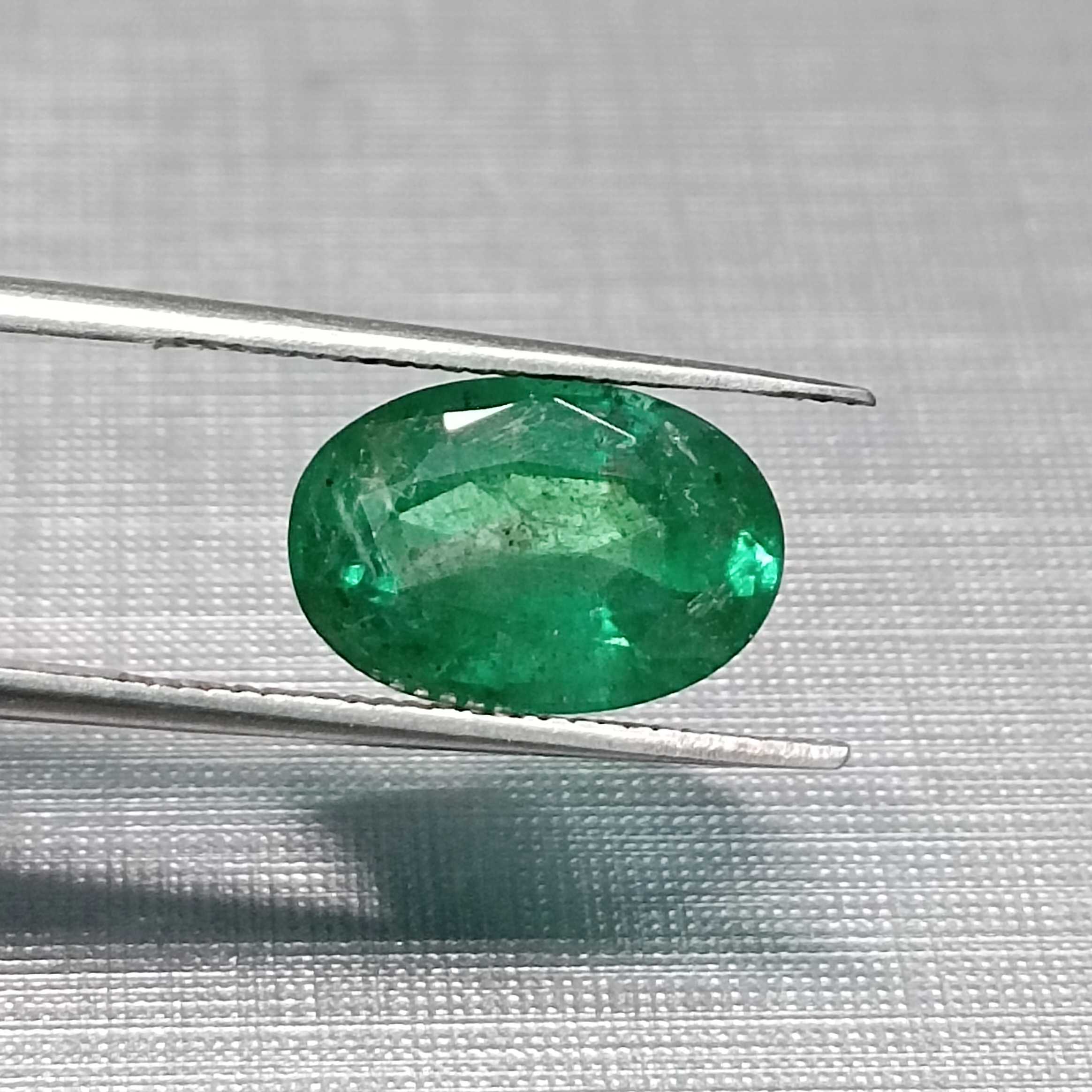 3.24ct GSI certified oval cut medium deep golden green emerald gem