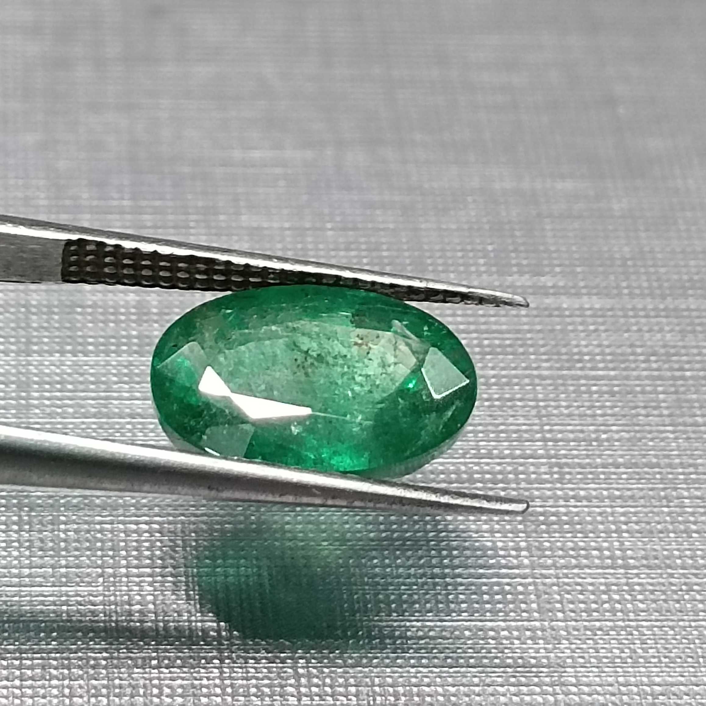 3.24ct GSI certified oval cut medium deep golden green emerald gem