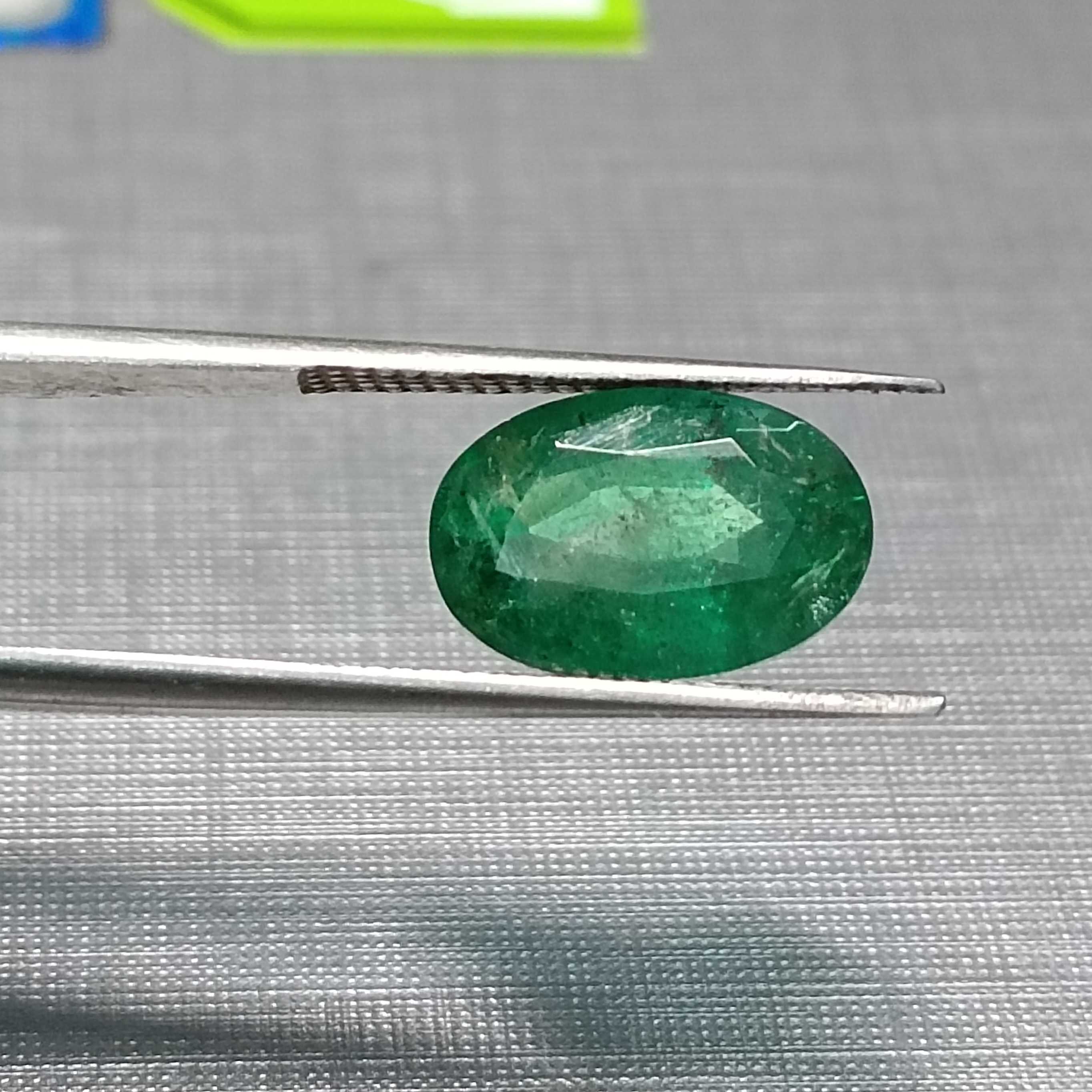 3.24ct GSI certified oval cut medium deep golden green emerald gem