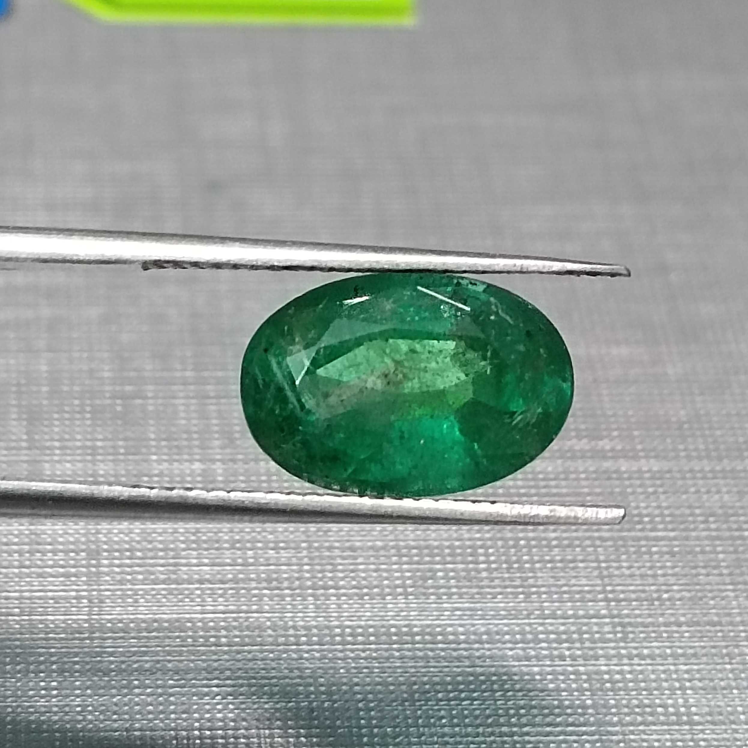 3.24ct GSI certified oval cut medium deep golden green emerald gem