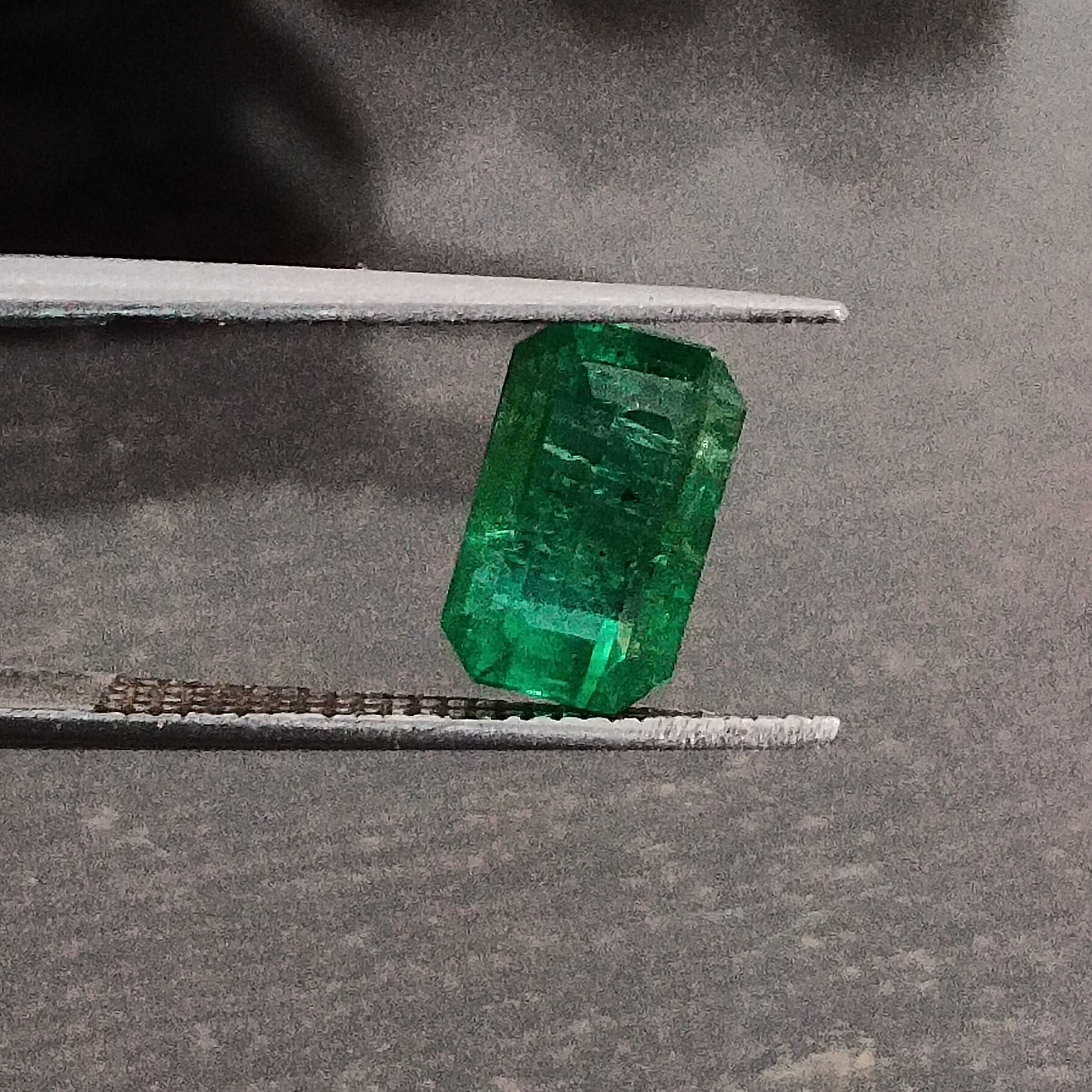 2.06ct certified vivid green octagon cut emerald gemstone