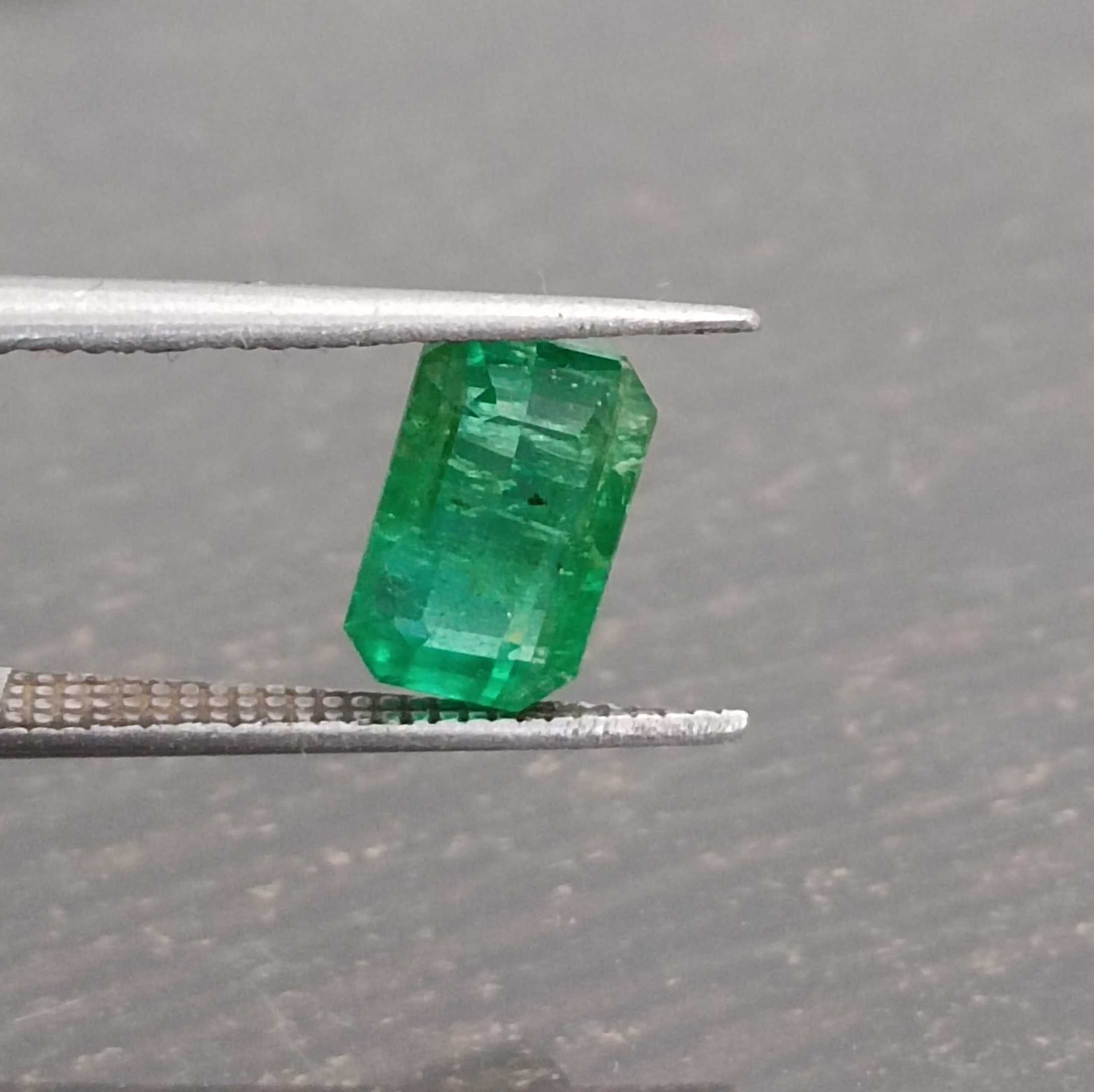 2.06ct certified vivid green octagon cut emerald gemstone