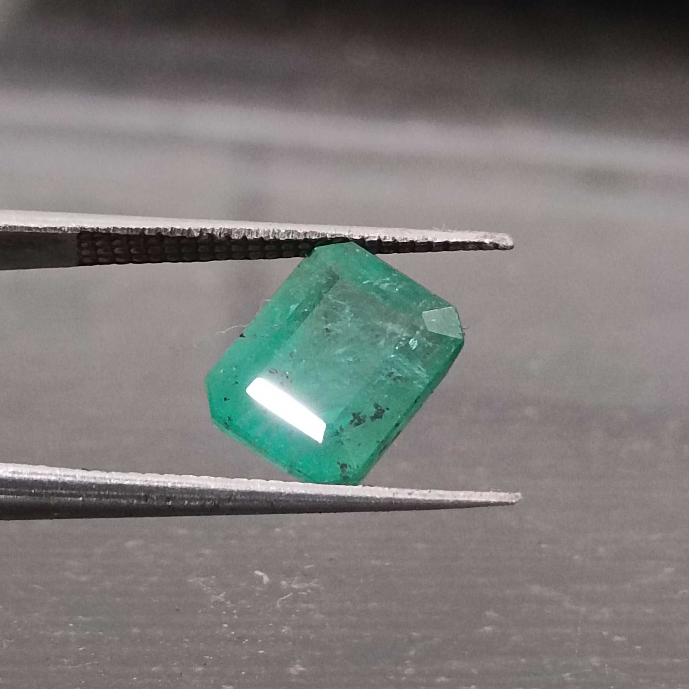 3.06ct GSI certified medium green emerald cut emerald stone