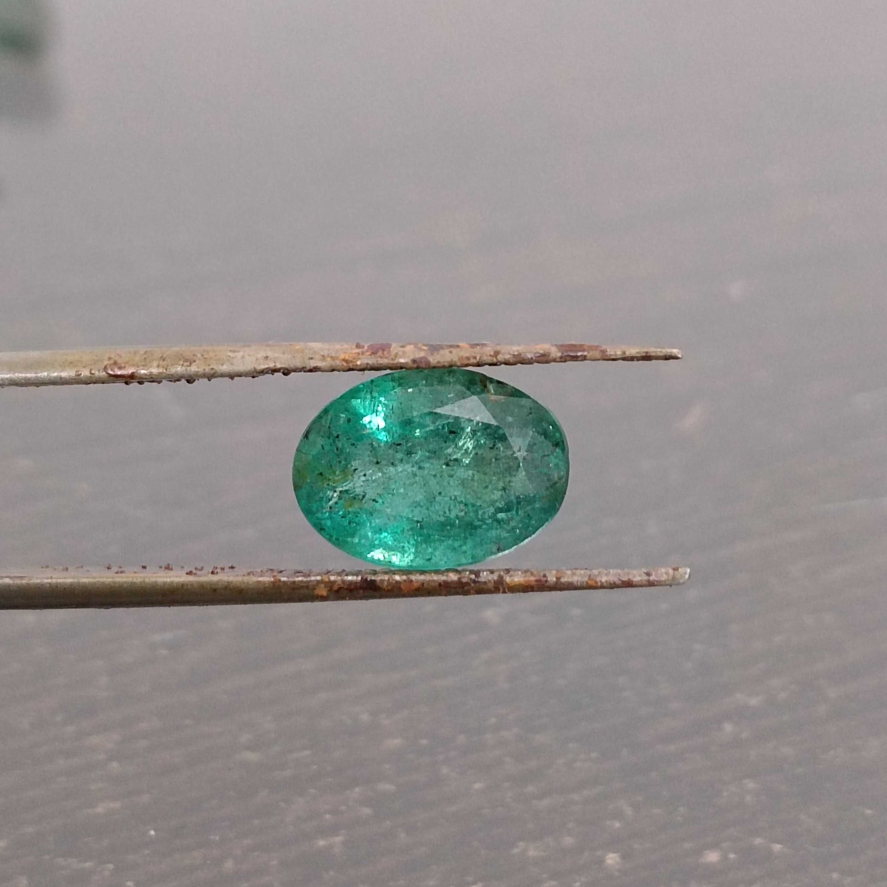 2.88cts bright very deep golden green oval cut Zambian emerald stone