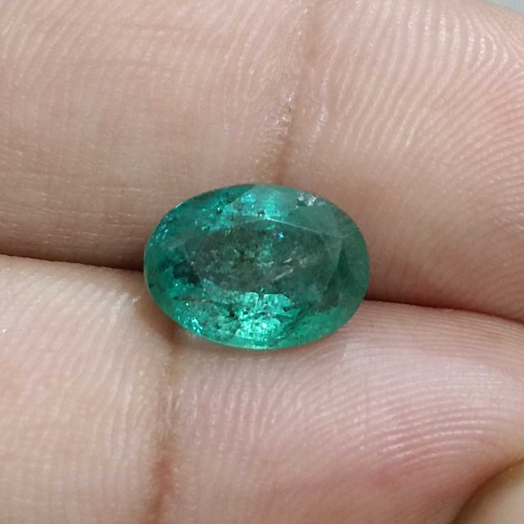 3.68ct medium deep green color oval cut emerald stone