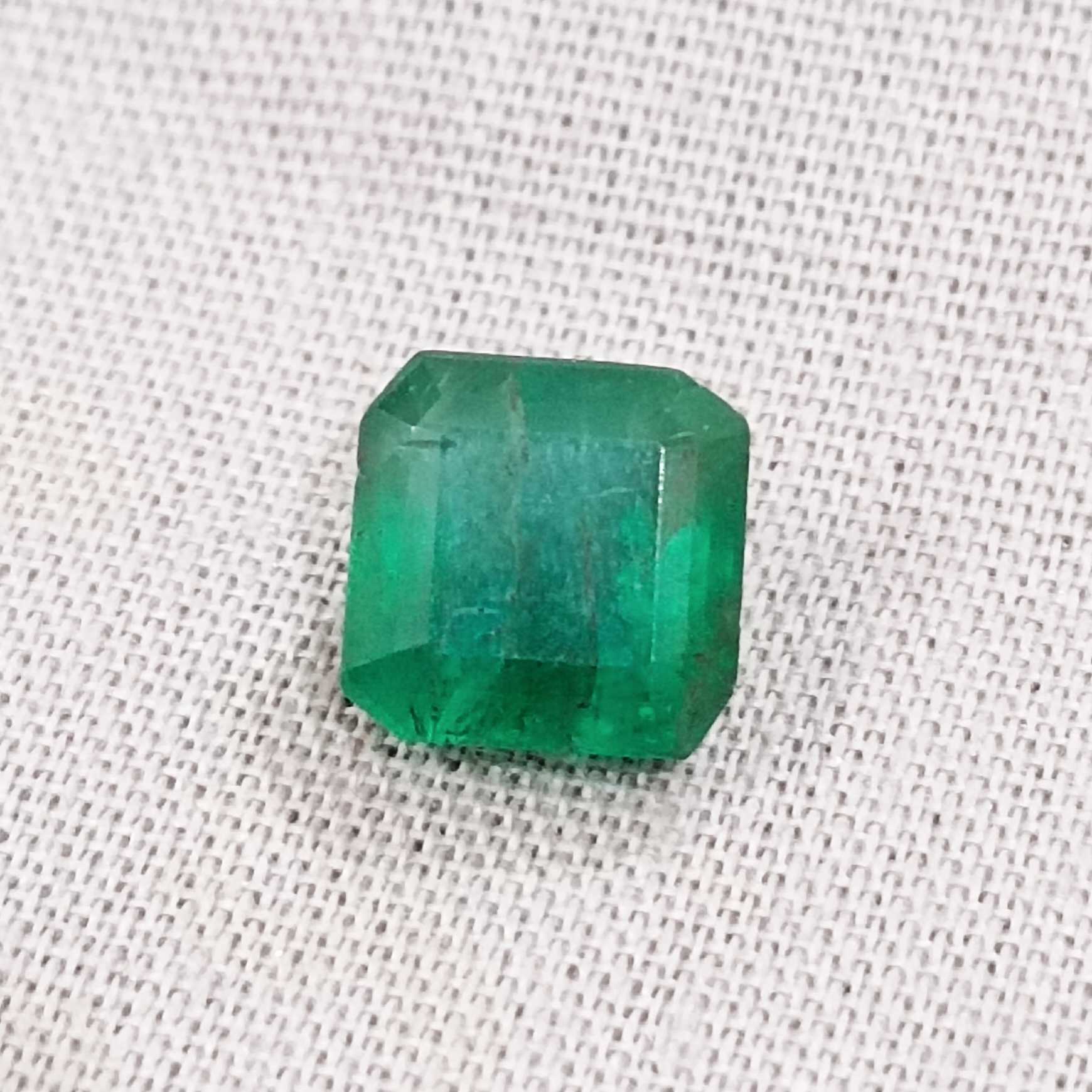 2.28ct deep green emerald gem with bluish and yellowish hue /