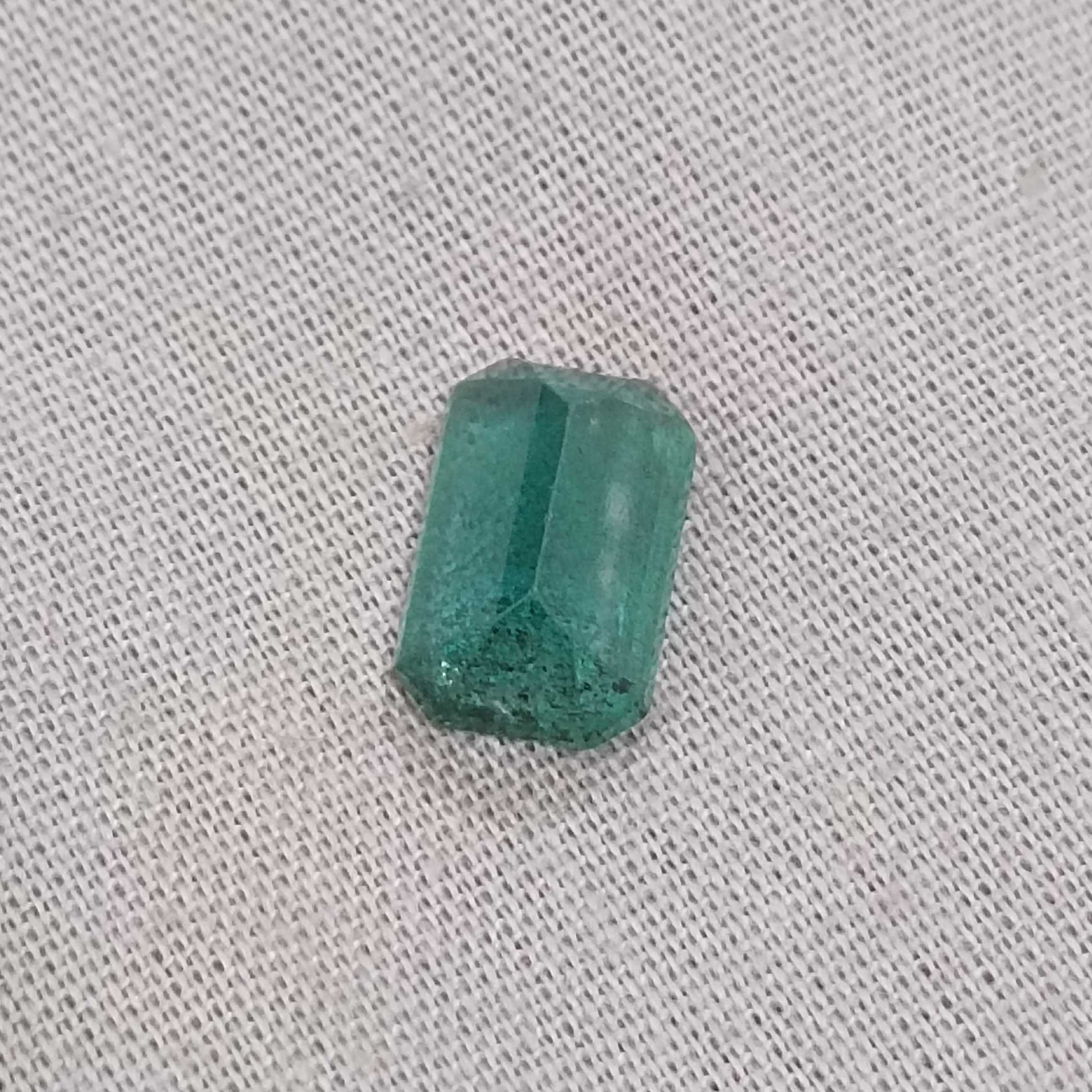 2.42ct deep medium green with blue tint octagon Zambian emerald