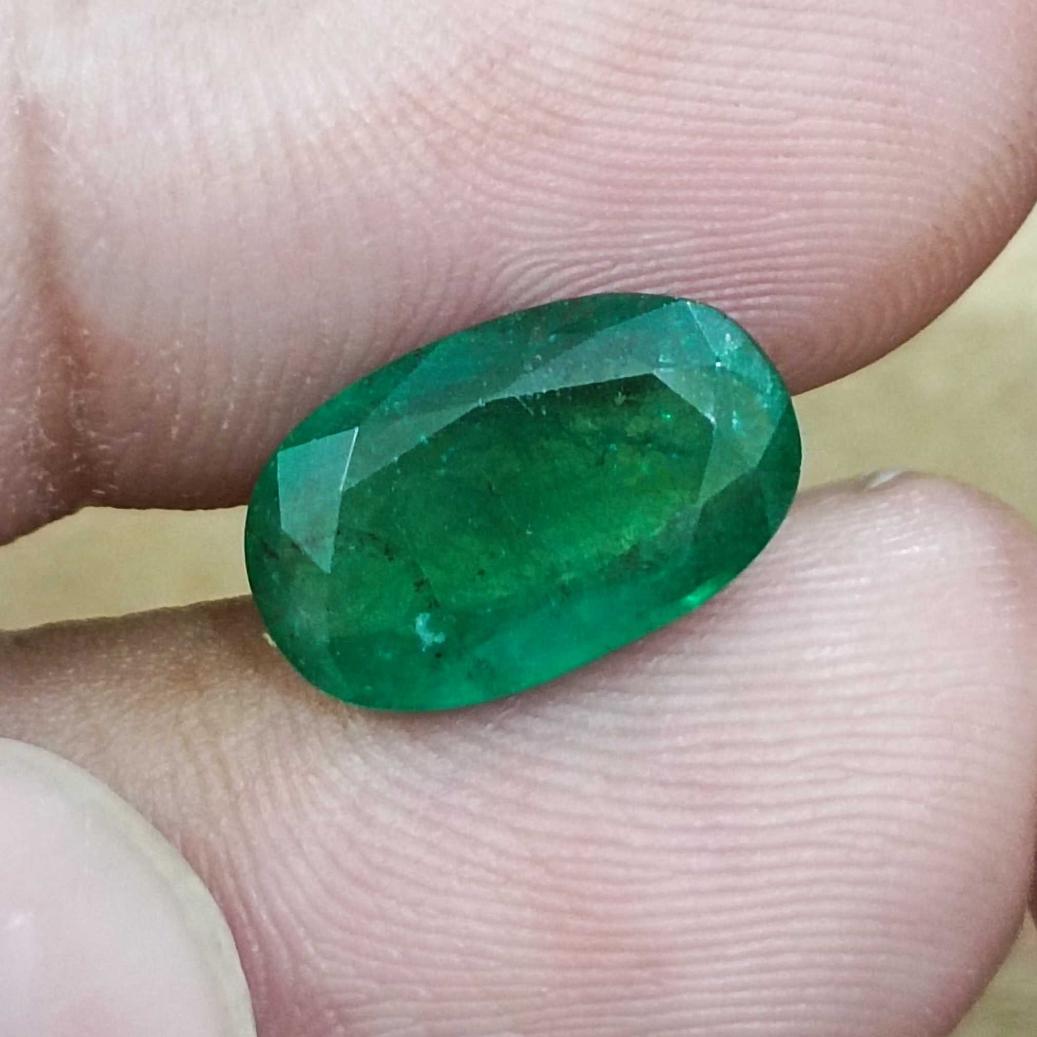 4.36ct GSI certified deep vivid green elongated oval cut Zambian emerald gem  