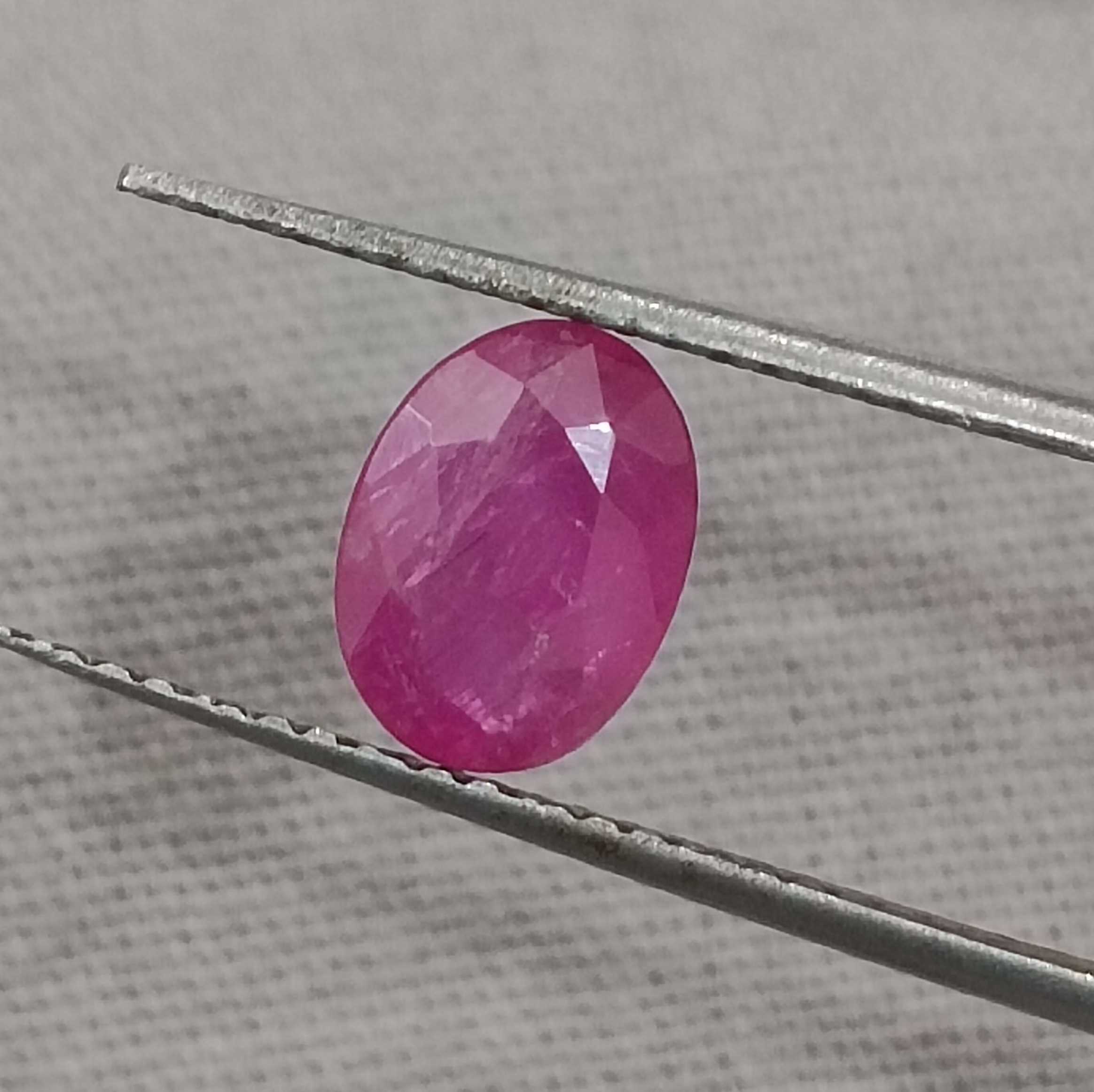 1.32cts certified glossy pinkish red transparent oval cut unheated African ruby gem