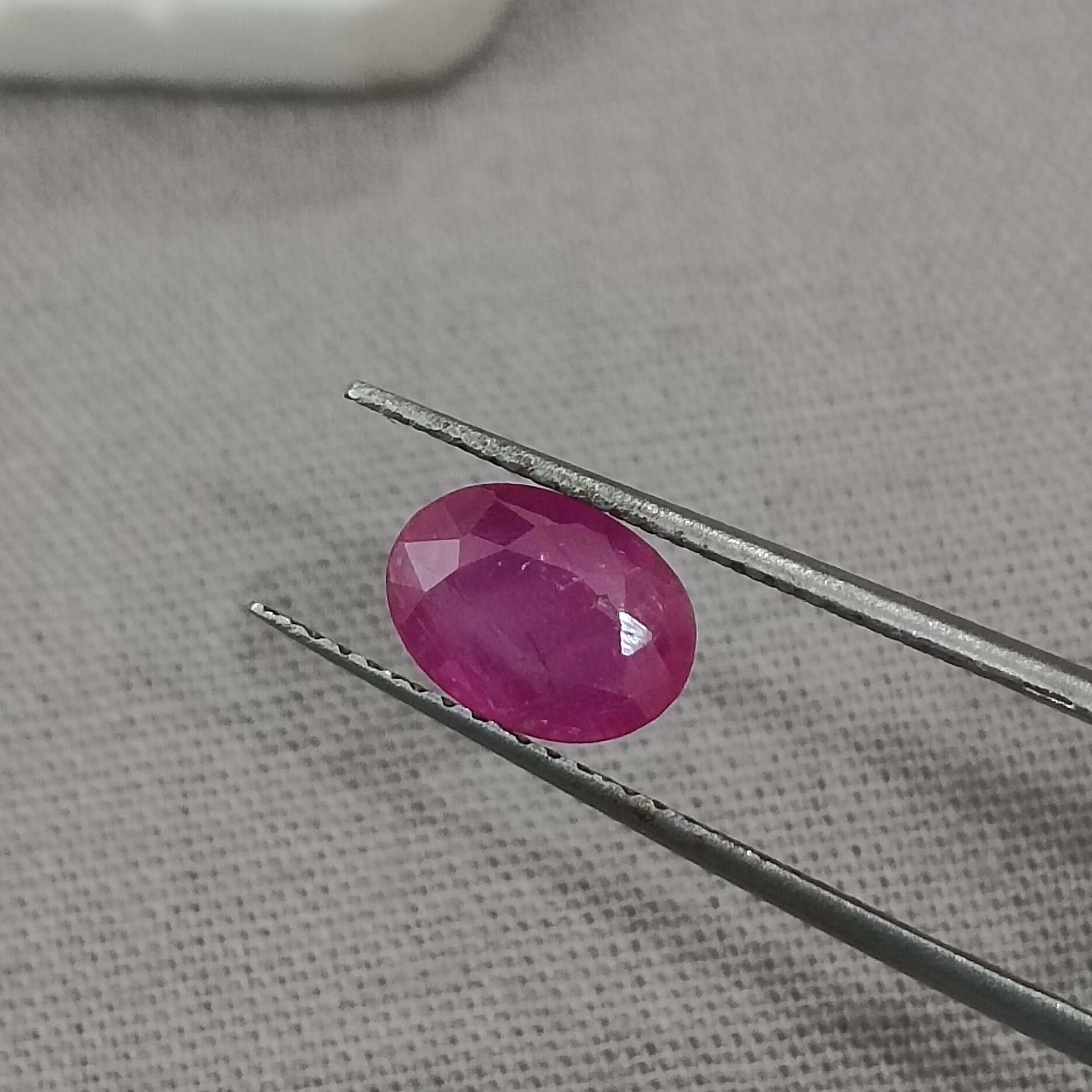 1.32cts certified glossy pinkish red transparent oval cut unheated African ruby gem