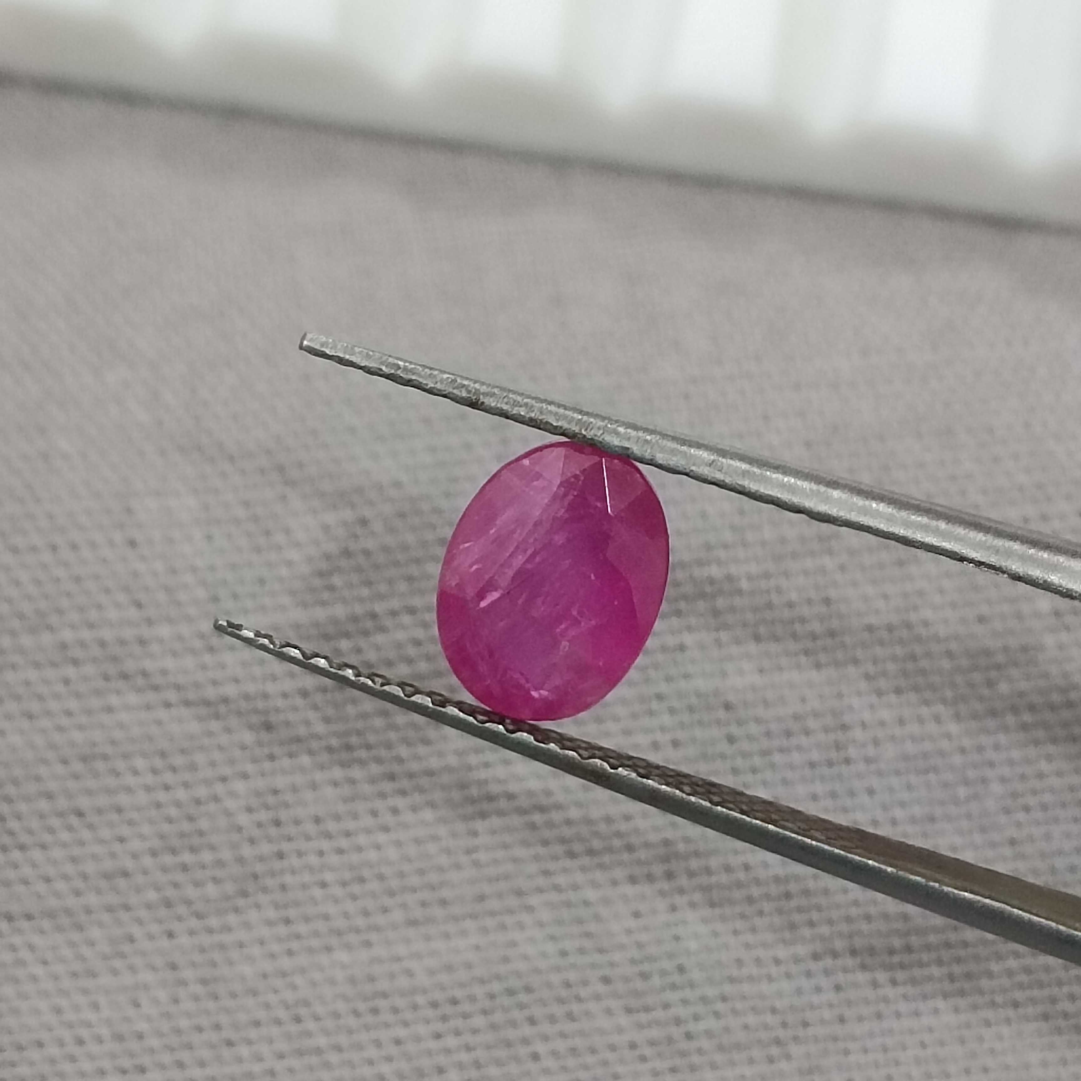 1.32cts certified glossy pinkish red transparent oval cut unheated African ruby gem