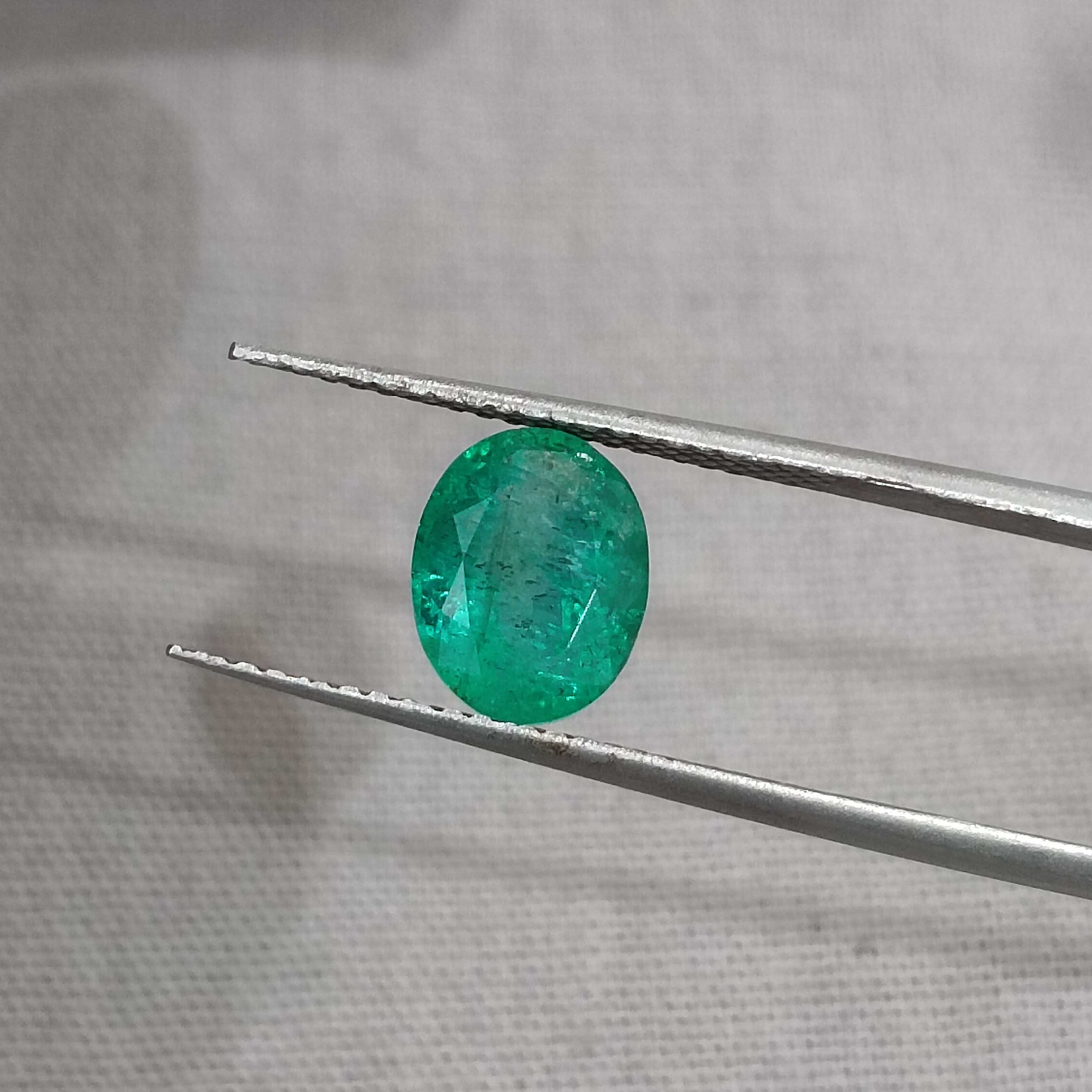 1.64ct medium deep green oval shaped Zambia origin emerald 