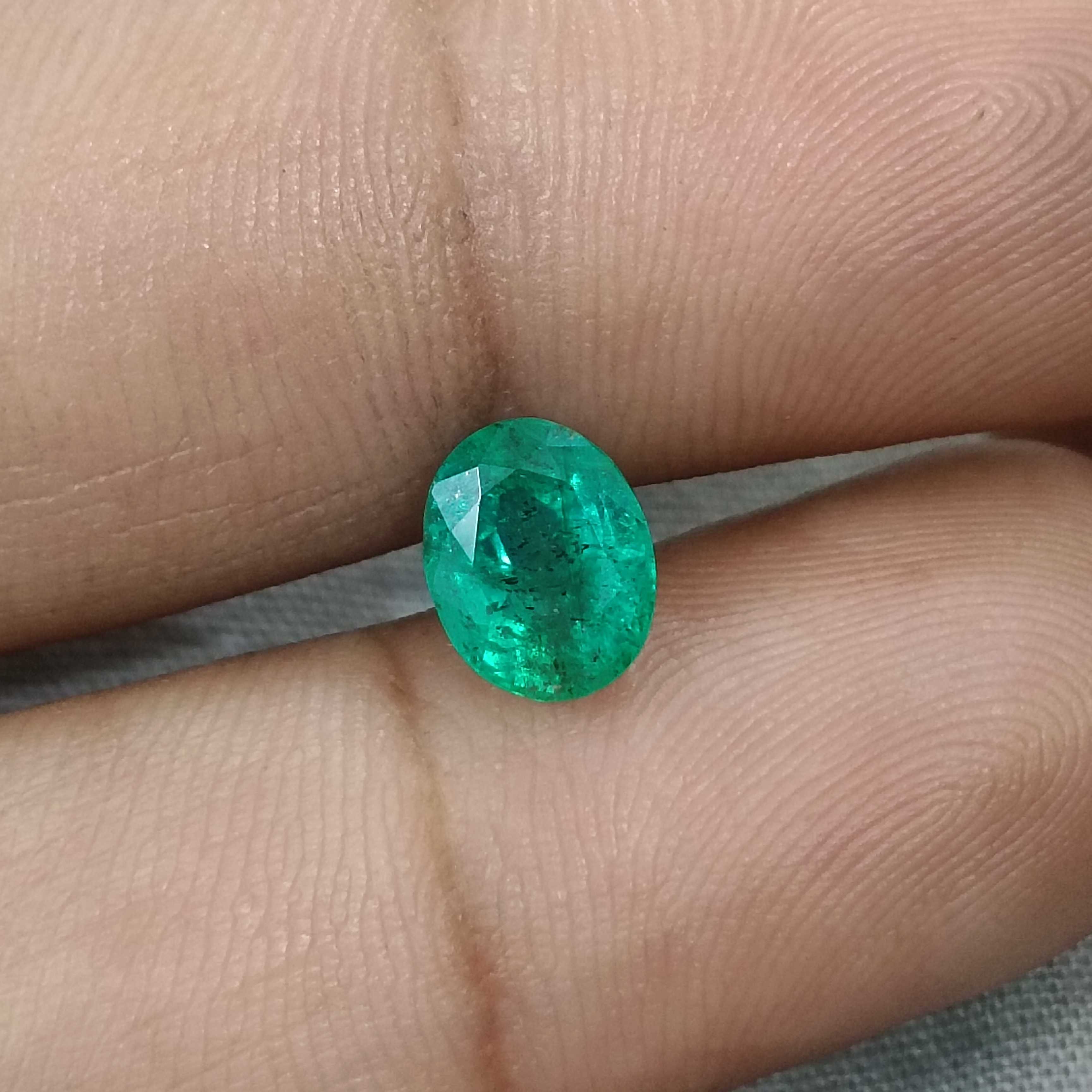1.64ct medium deep green oval shaped Zambia origin emerald 
