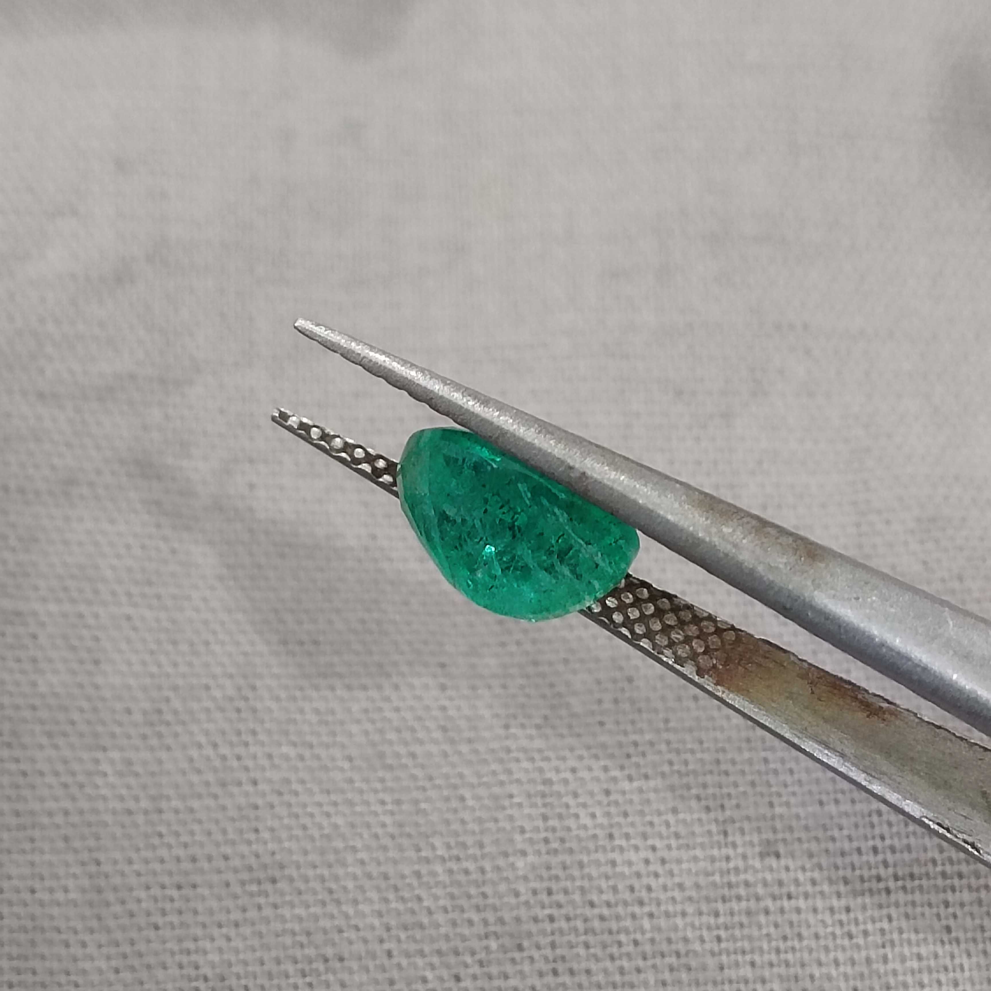 1.64ct medium deep green oval shaped Zambia origin emerald 