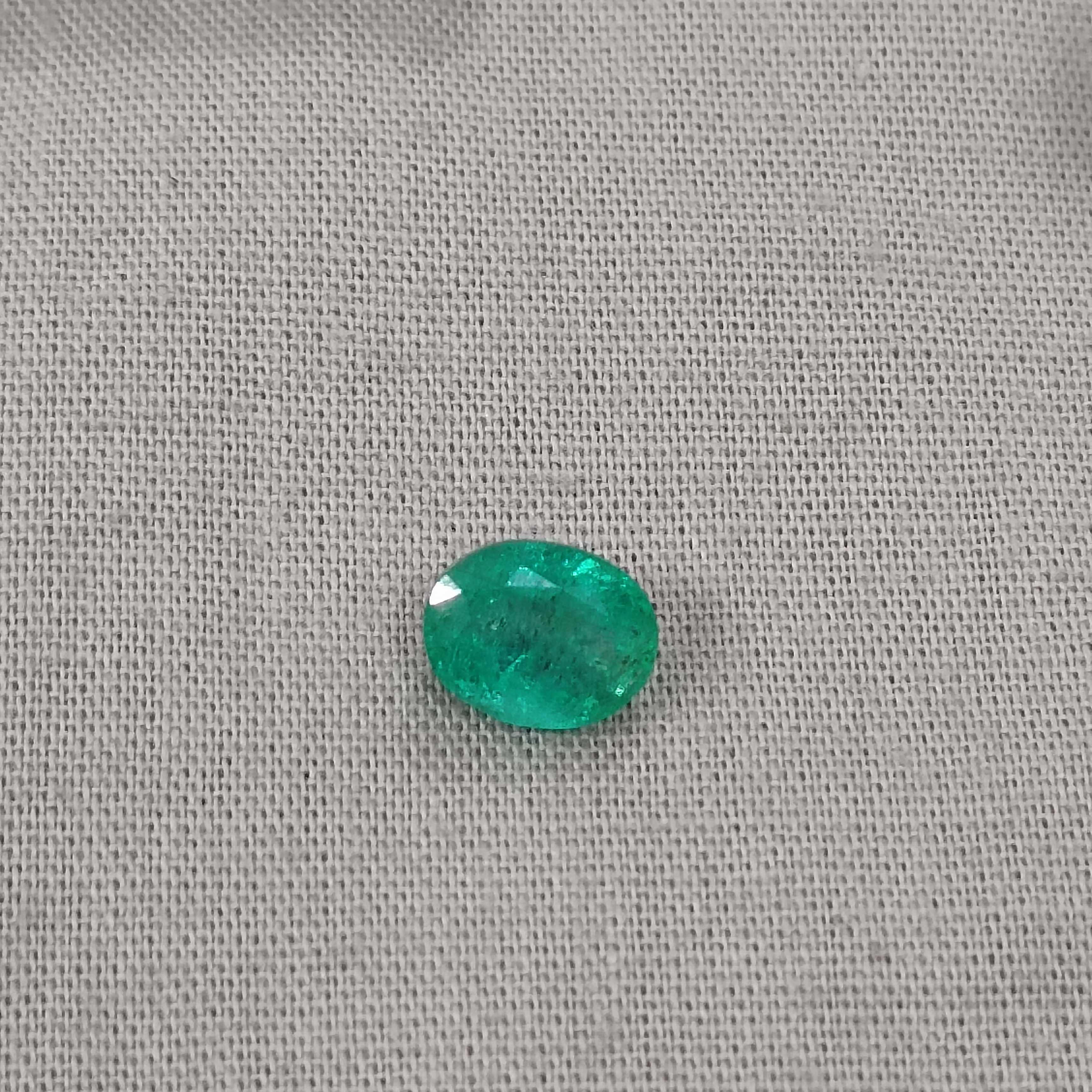 1.64ct medium deep green oval shaped Zambia origin emerald 