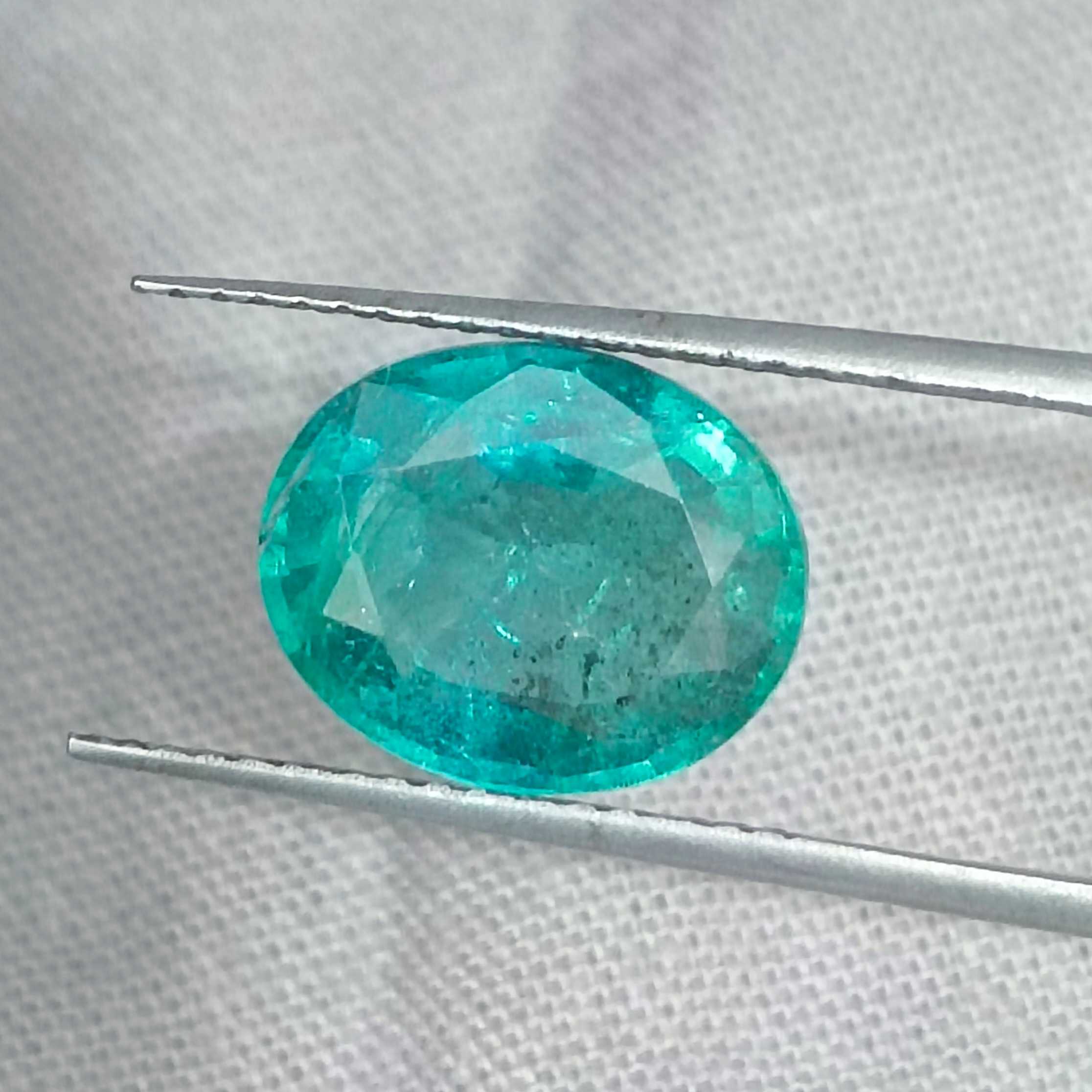 2.93cts certified bluish medium green oval cut emerald /