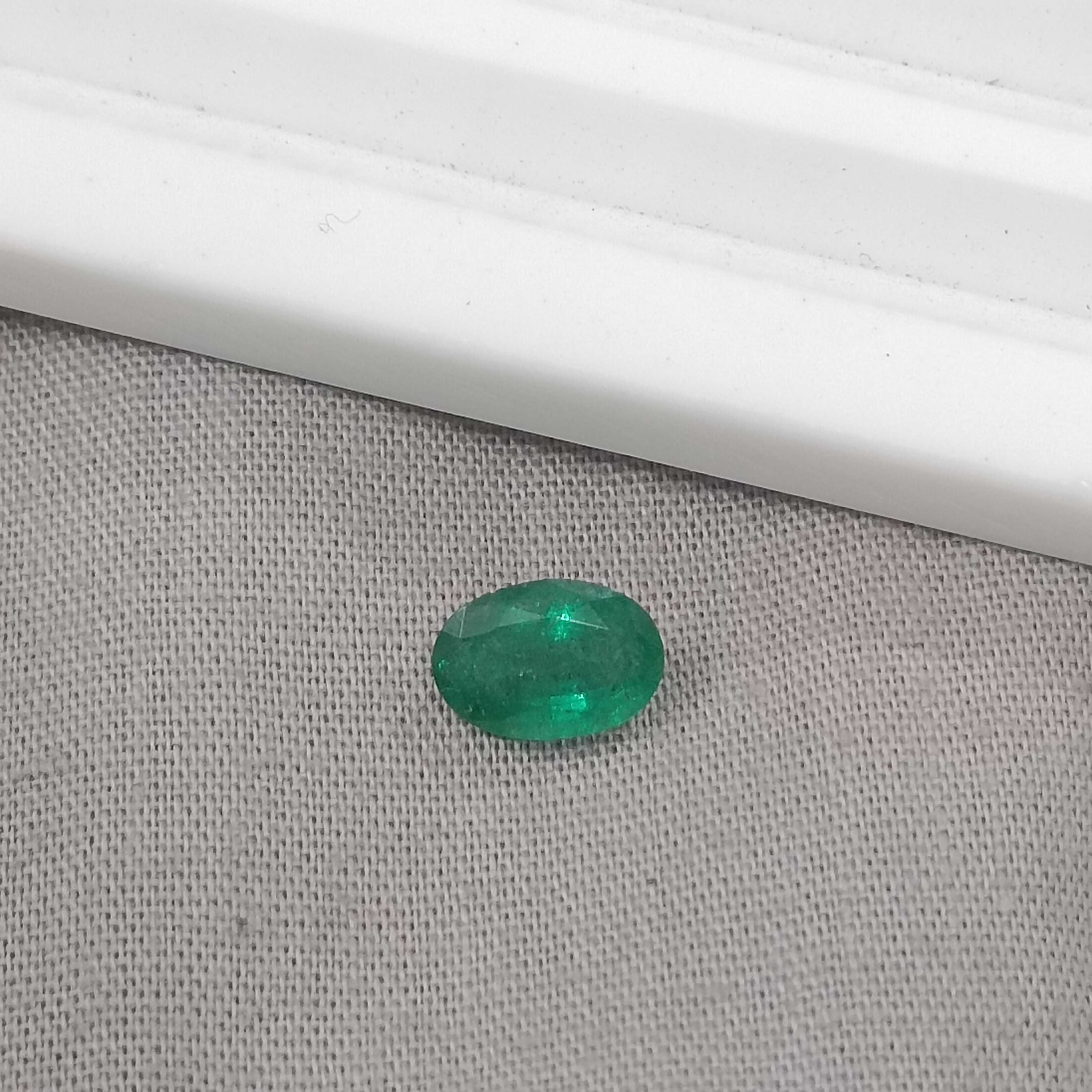 1.05cts GSI certified deep golden green oval cut Zambian emerald 