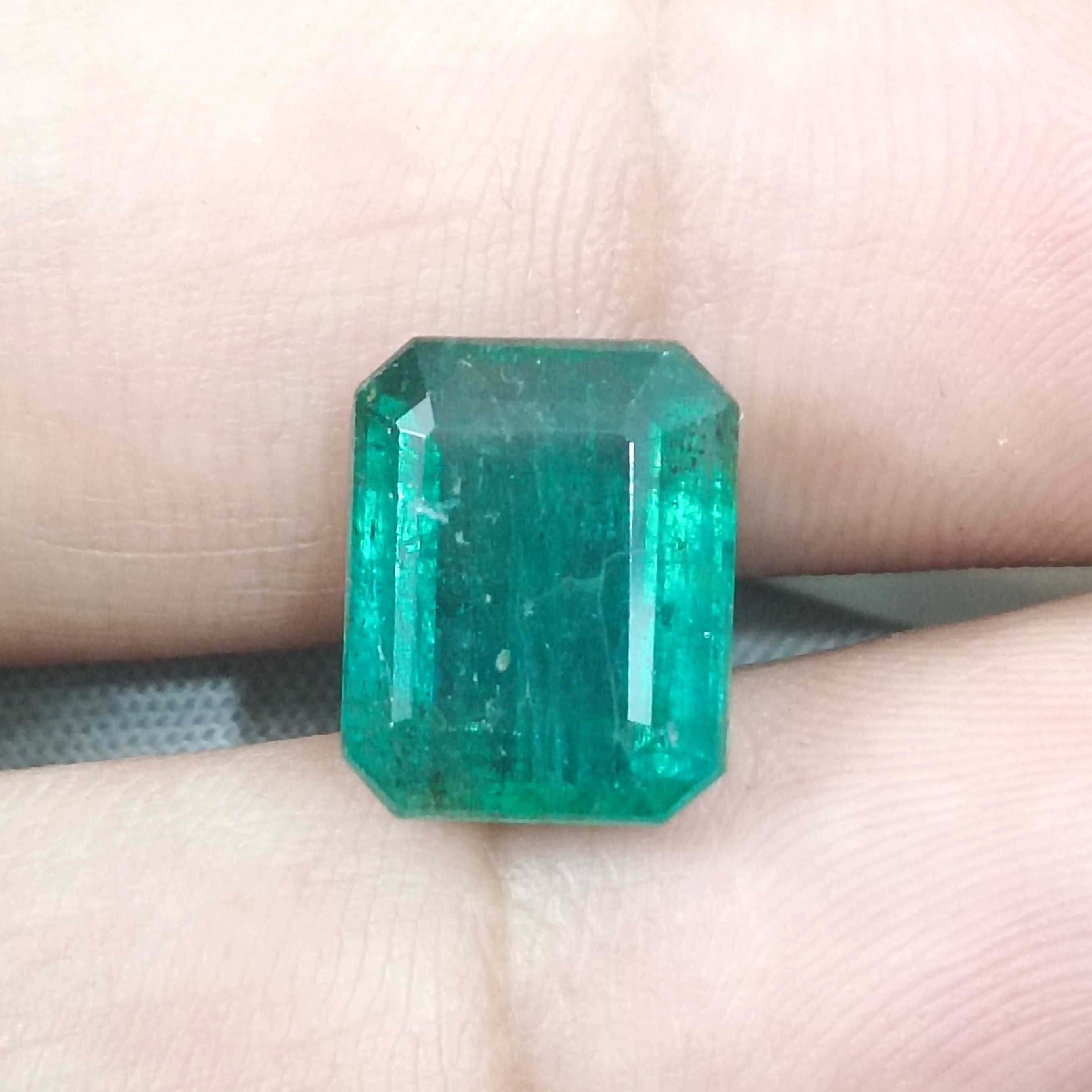 6.19cts bluish deep green octagon cut Zambian origin emerald gemstone 