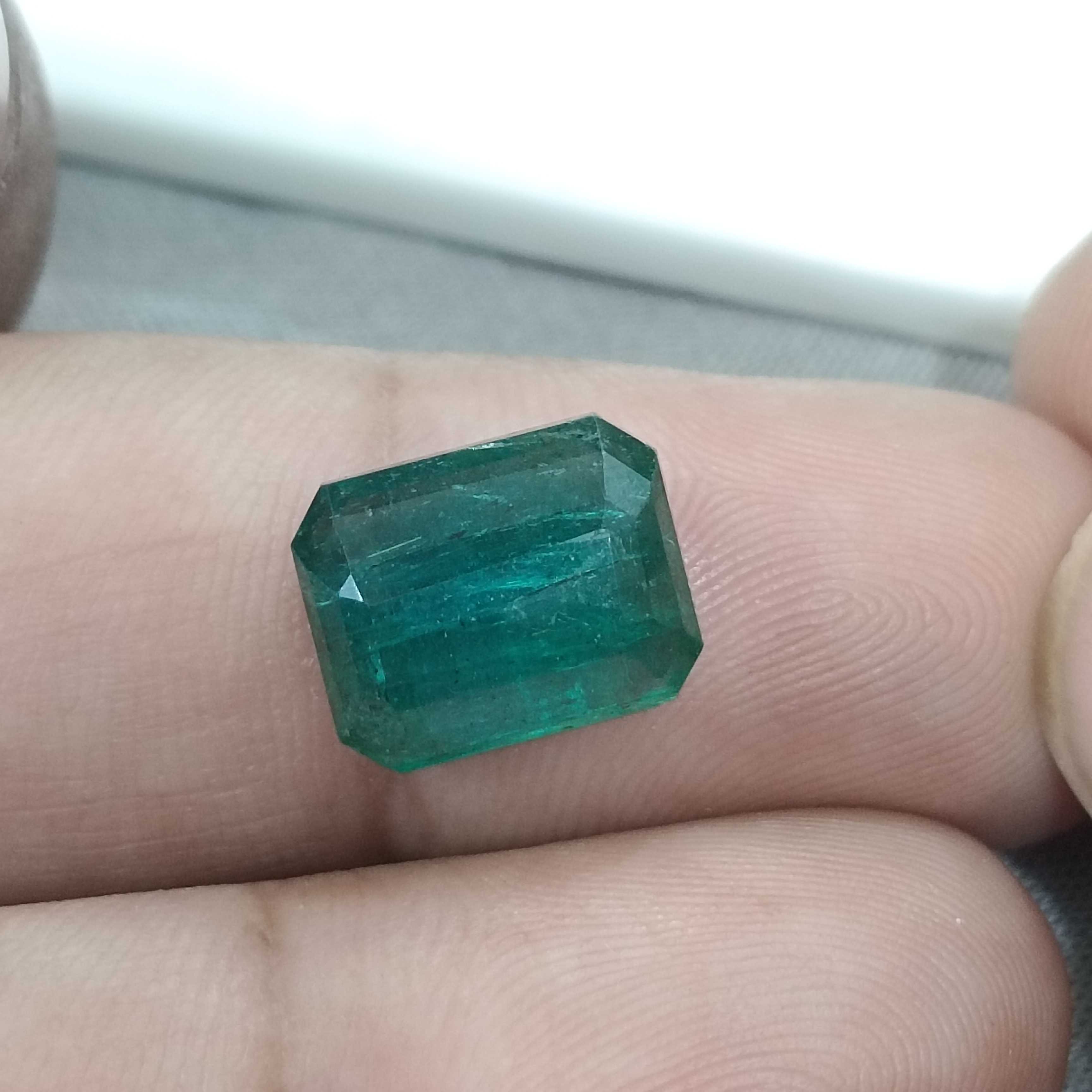 6.19cts bluish deep green octagon cut Zambian origin emerald gemstone 