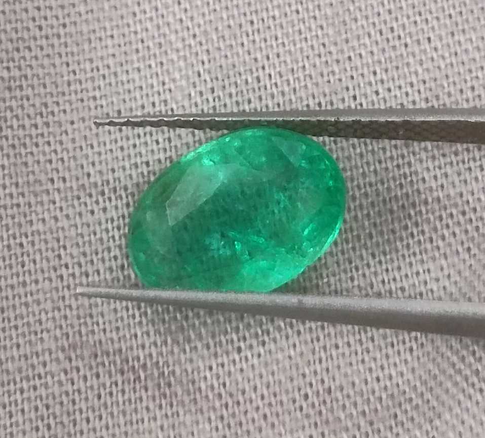 2.57ct GSI certified neon green oval cut Zambian emerald 