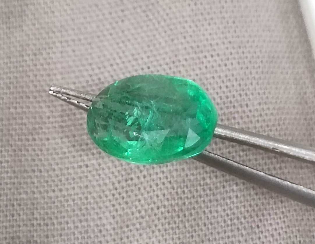 2.57ct GSI certified neon green oval cut Zambian emerald 