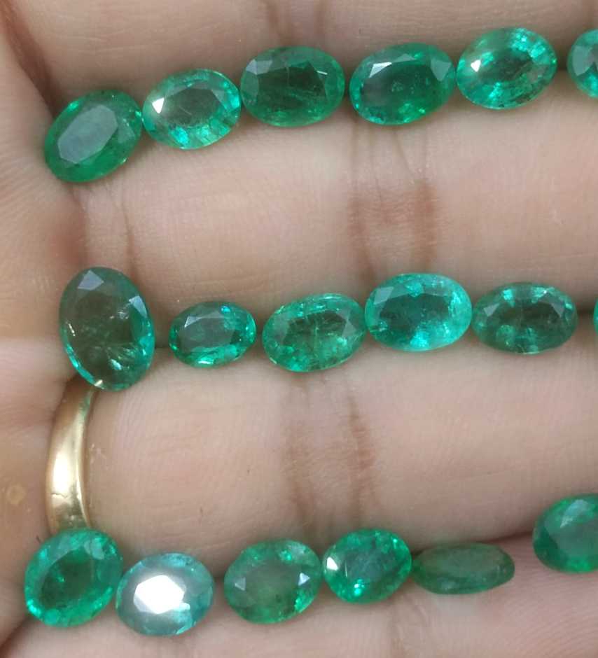 24.31ct oval cut shiny natural loose Zambian emerald wholesale parcel