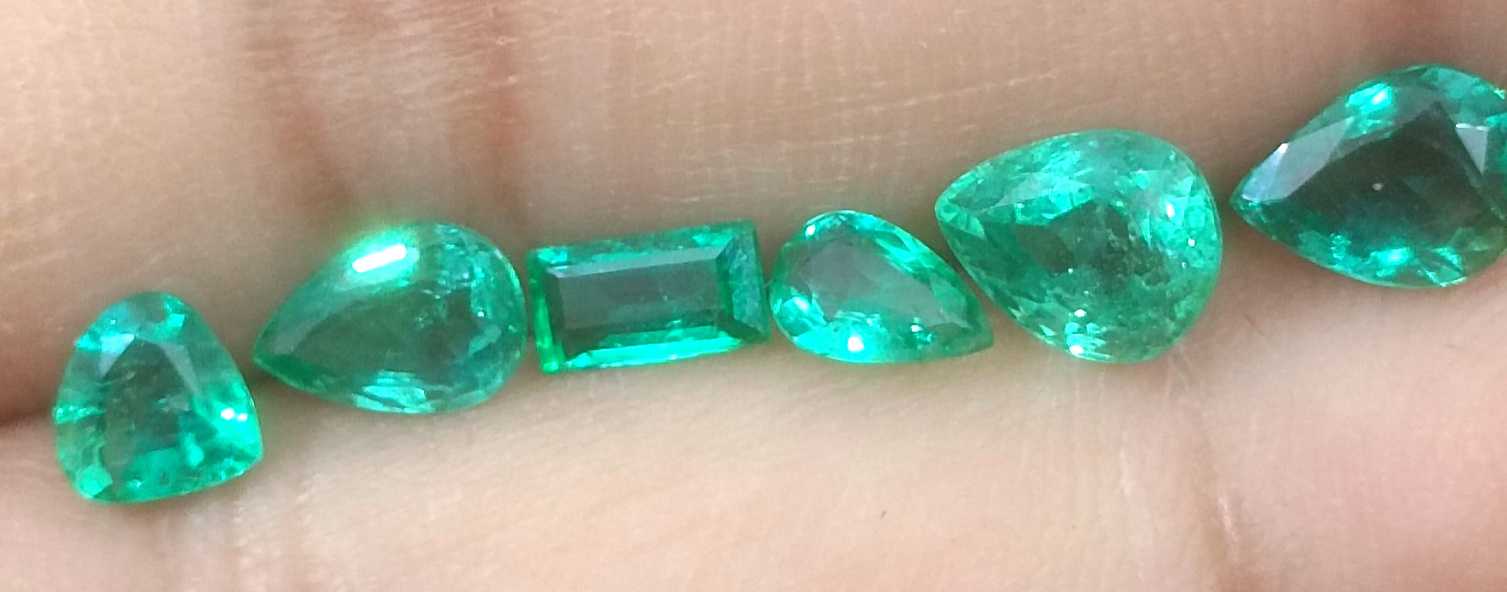 4.33ct medium to medium deep clean electric green loose Zambian emeralds