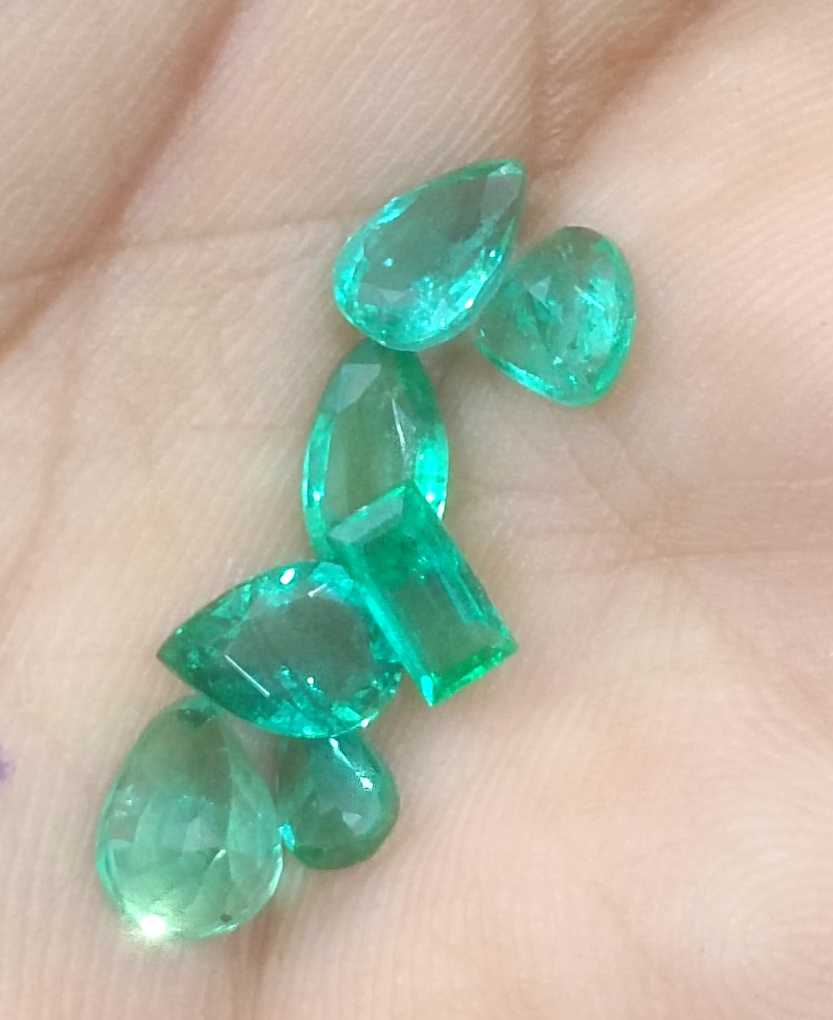4.33ct medium to medium deep clean electric green loose Zambian emeralds