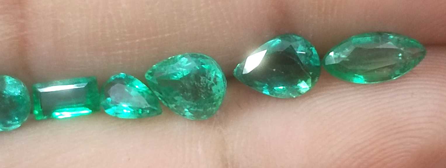 4.33ct medium to medium deep clean electric green loose Zambian emeralds