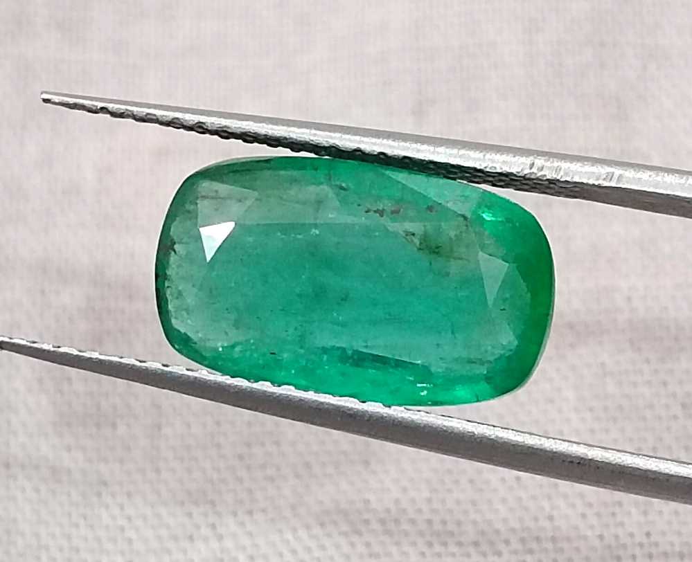 3.99ct deep green colour cushion cut Zambian emerald stone