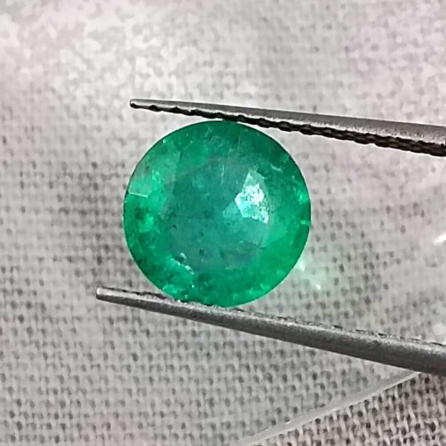 1.00ct GSI certified medium bright shamrock green Zambian emerald round 