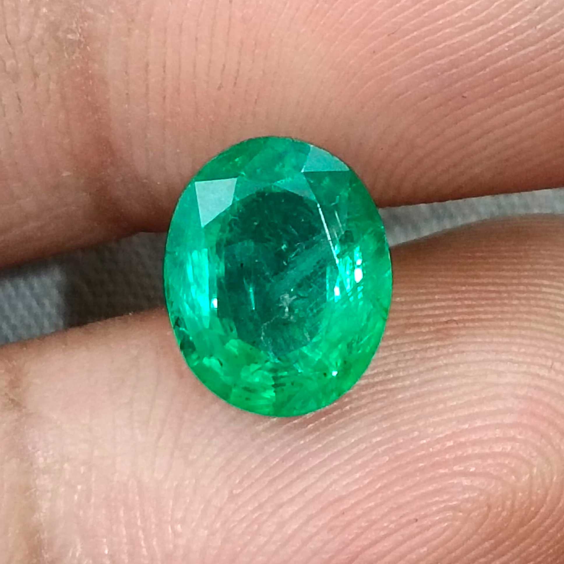 2.40ct Neon green oval cut natural certified Zambian emerald