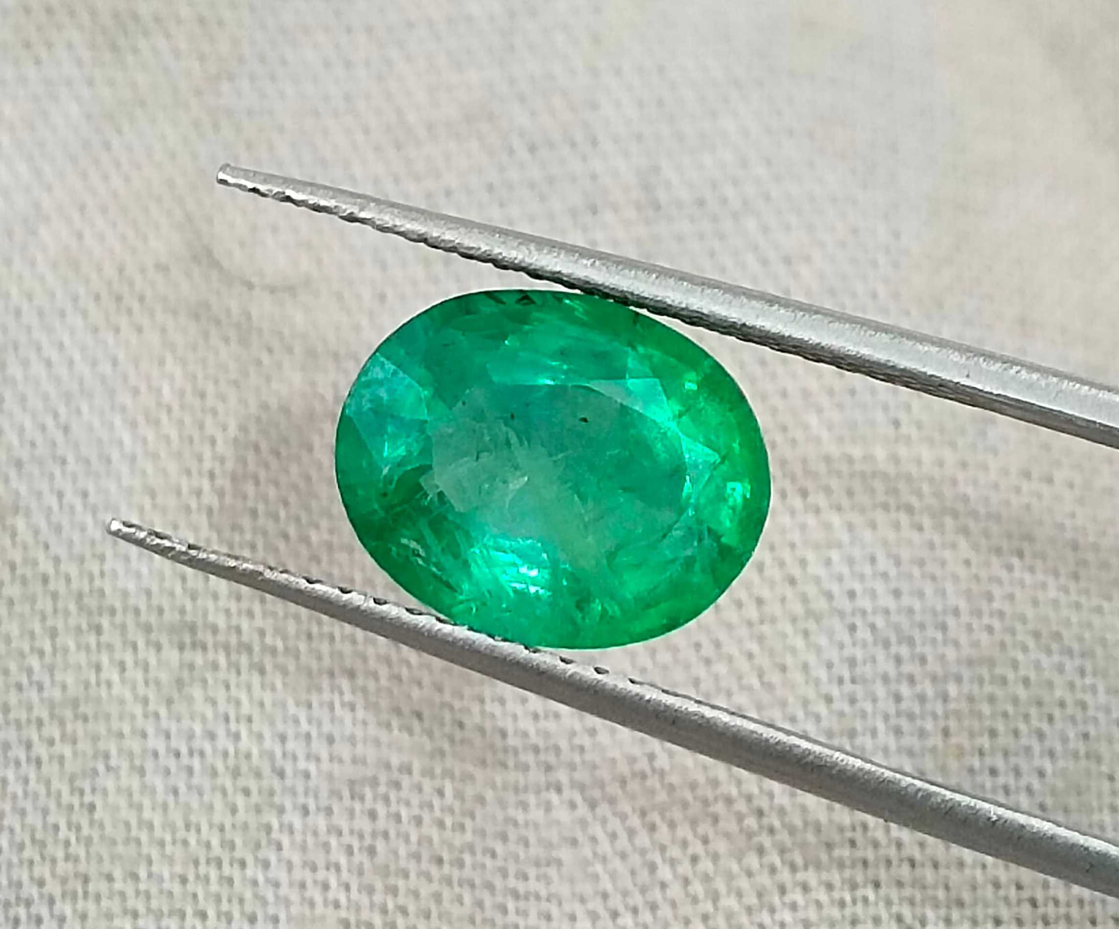 2.40ct Neon green oval cut natural certified Zambian emerald