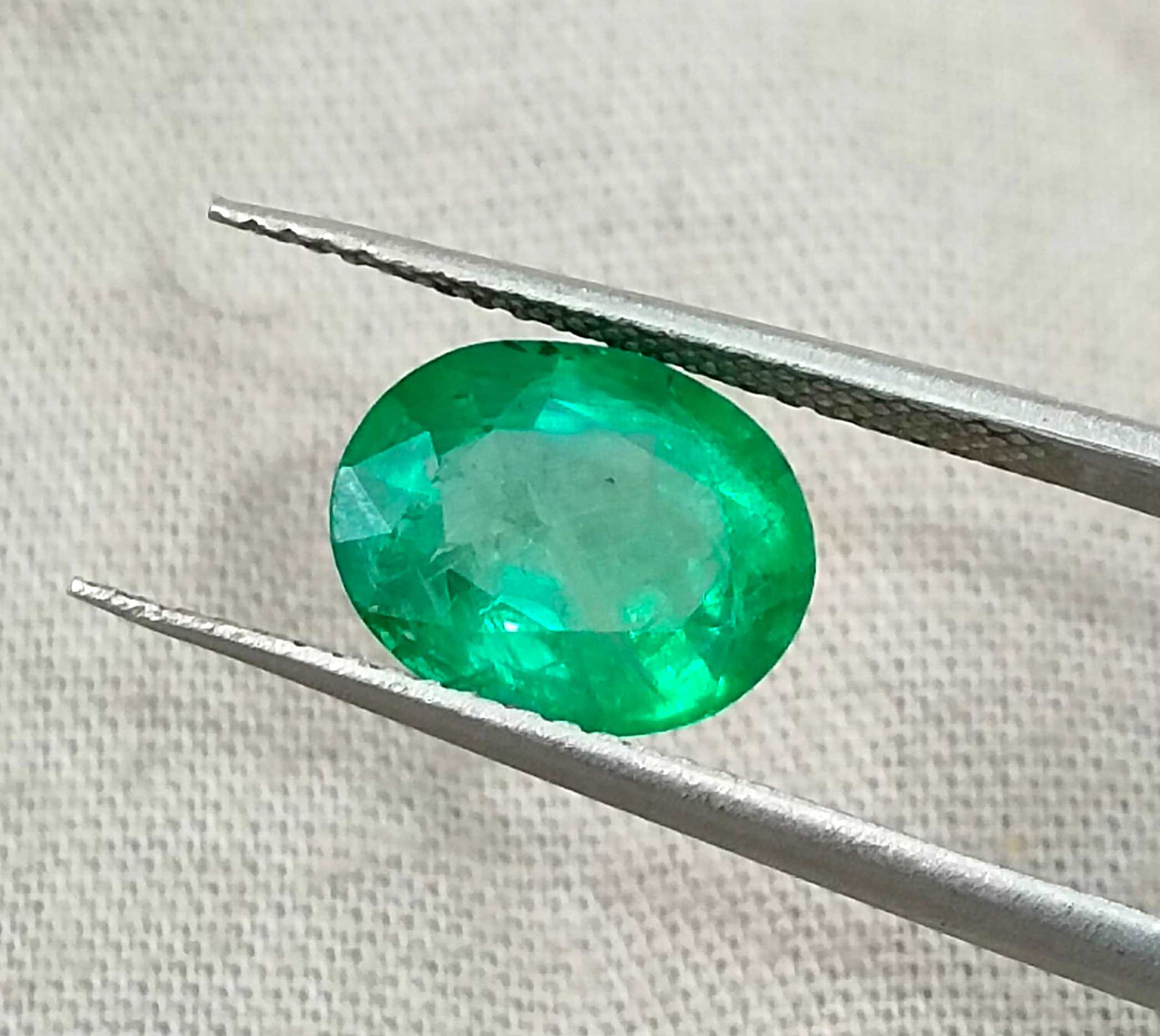 2.40ct Neon green oval cut natural certified Zambian emerald