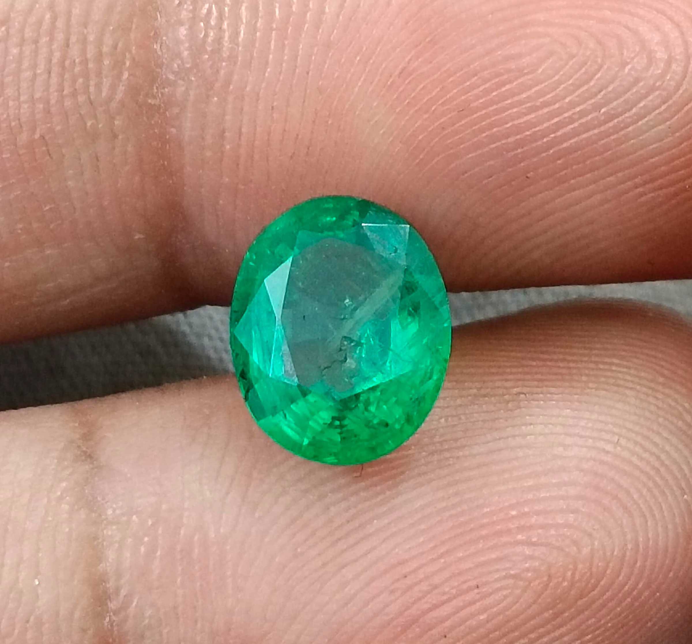 2.40ct Neon green oval cut natural certified Zambian emerald