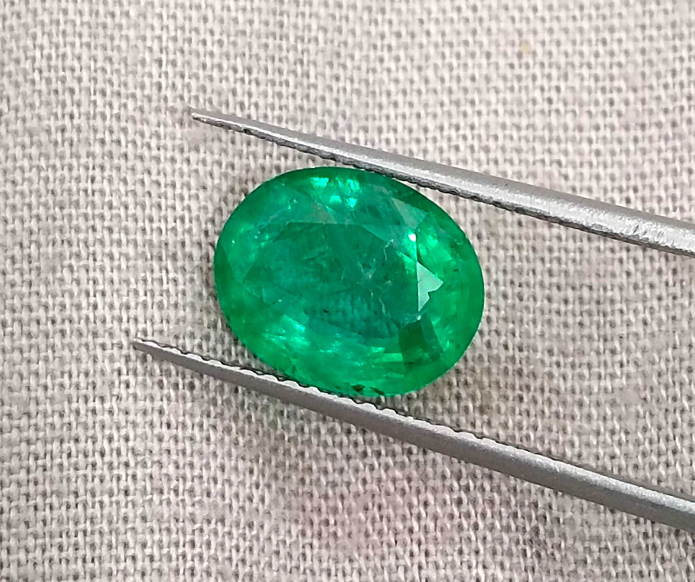 2.40ct Neon green oval cut natural certified Zambian emerald