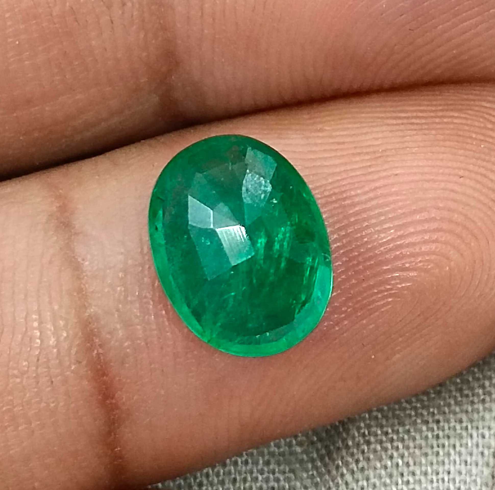2.40ct Neon green oval cut natural certified Zambian emerald