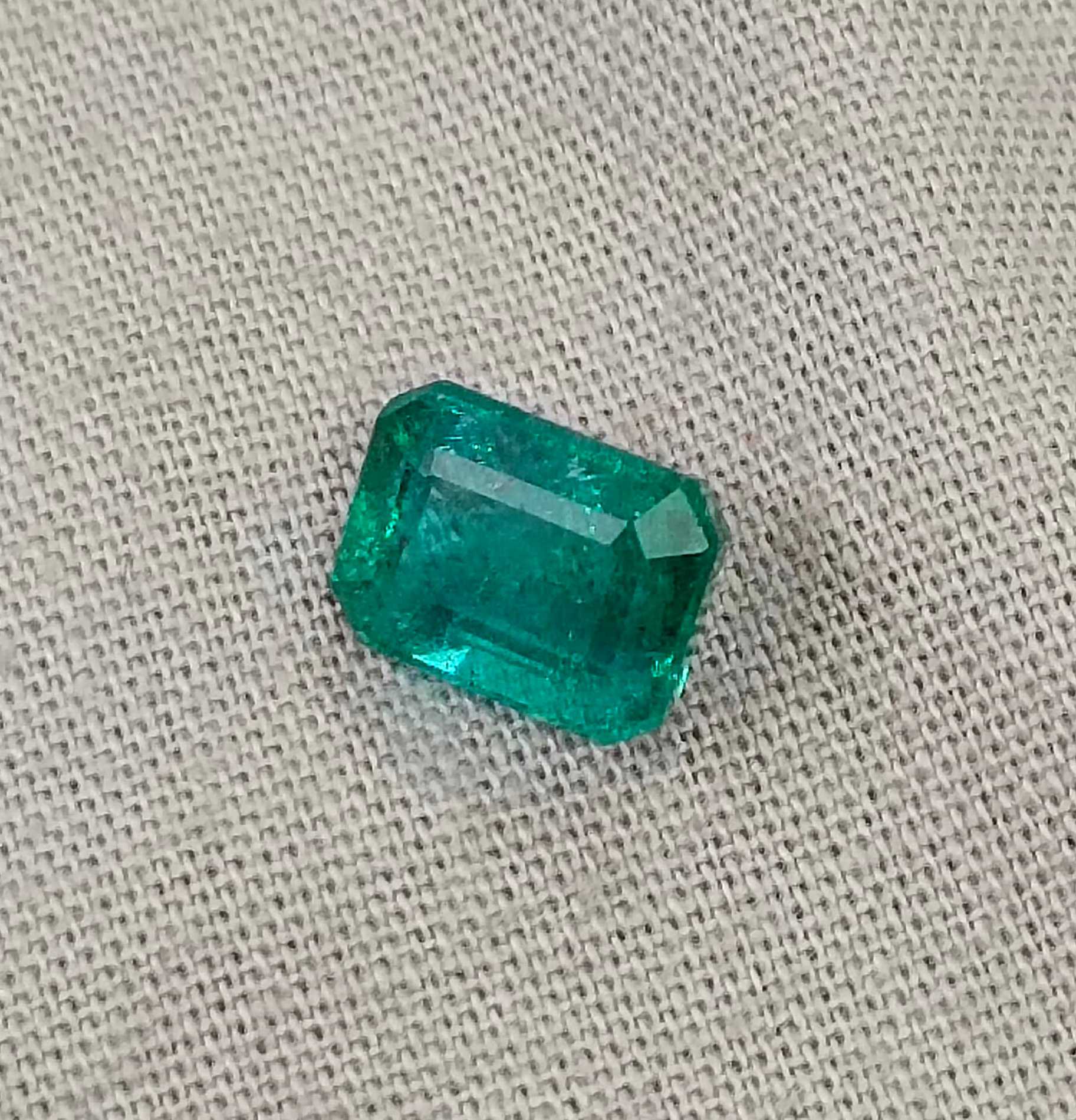 2.16ct Certified shiny medium deep bluish green Zambian emerald 