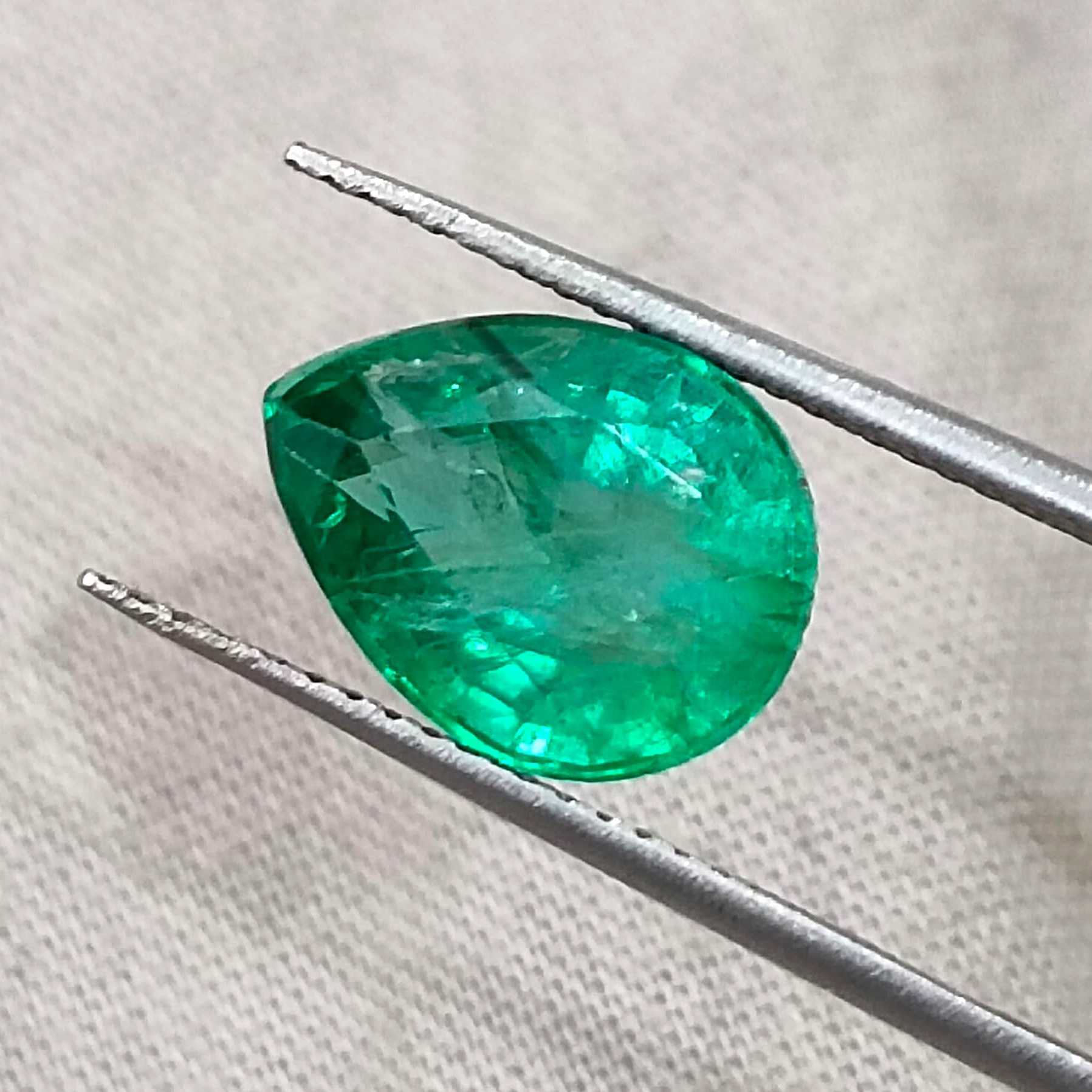 3.19ct GSI certified top shine bright spring green pear cut Zambian emerald 