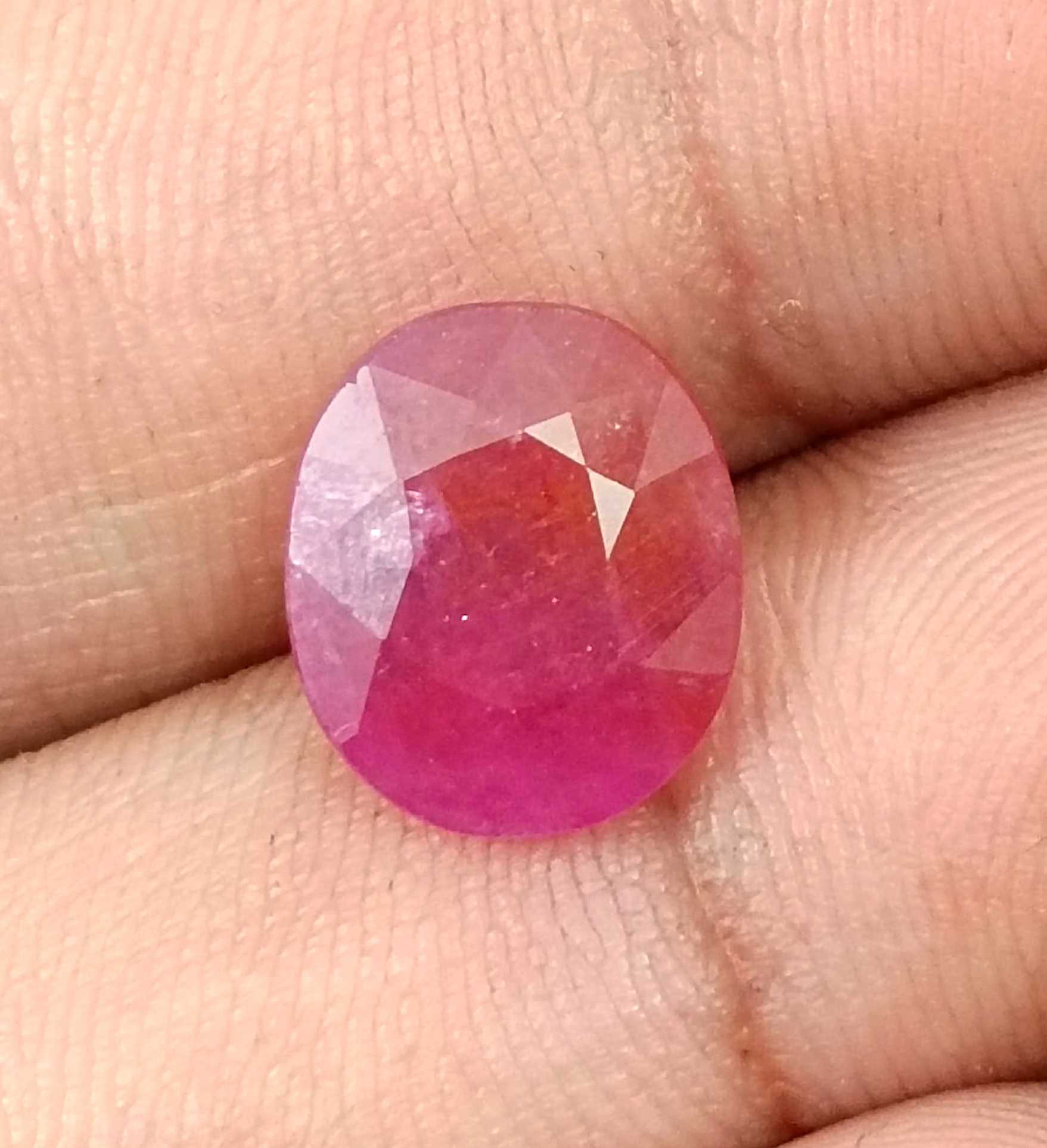 5.54ct GSI certified Mozambique ruby orangy red oval cut stone