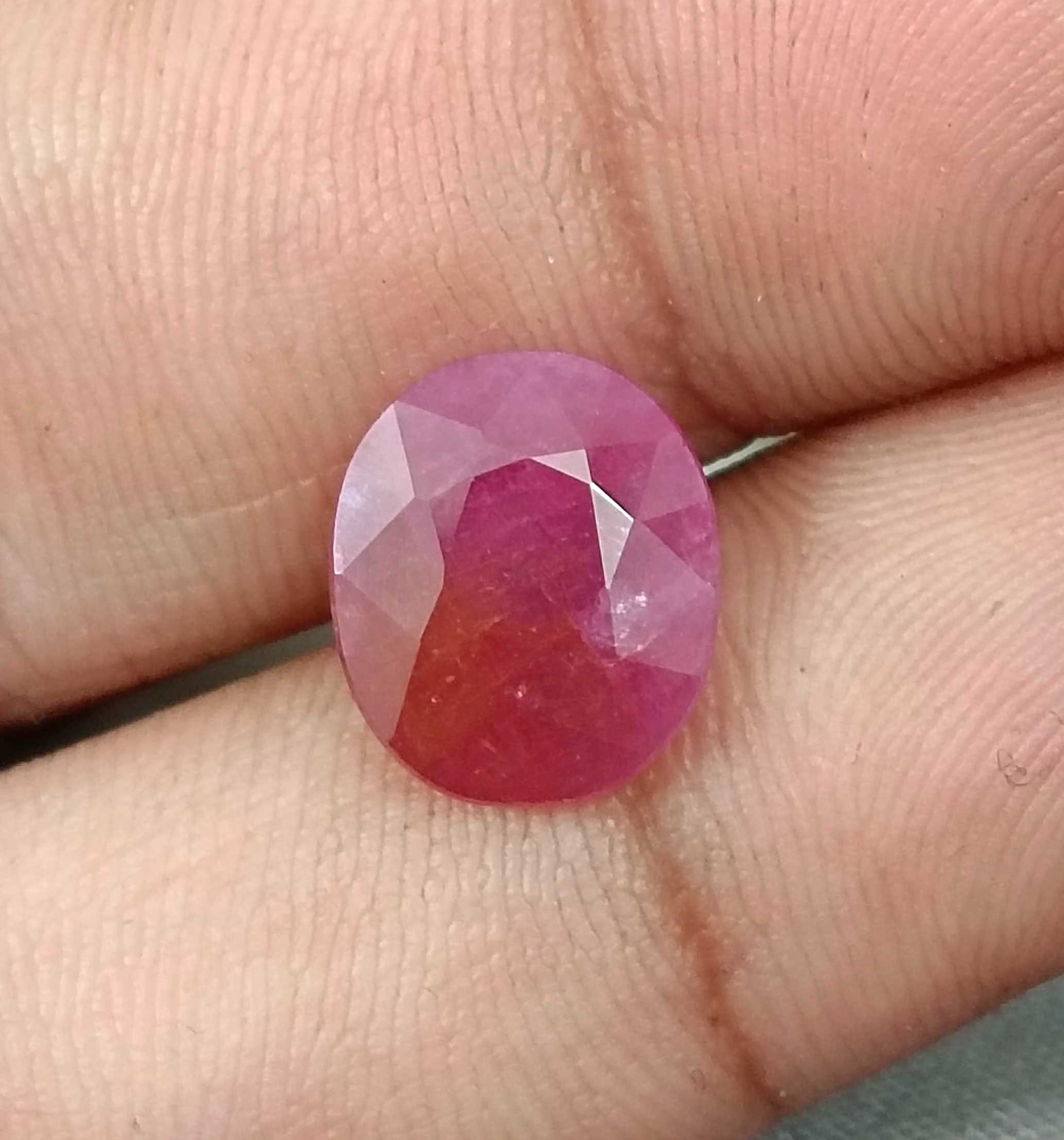 5.54ct GSI certified Mozambique ruby orangy red oval cut stone