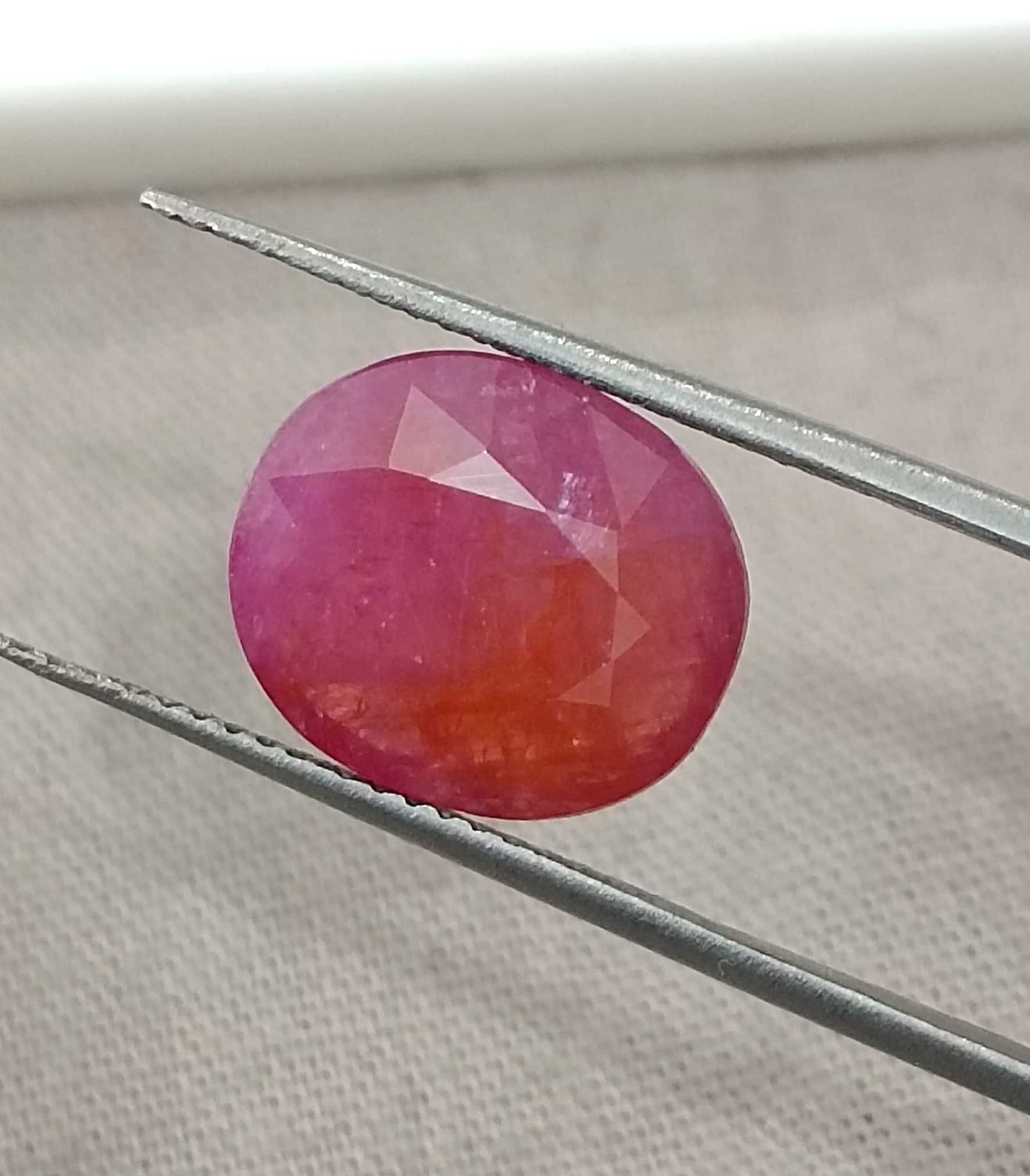5.54ct GSI certified Mozambique ruby orangy red oval cut stone